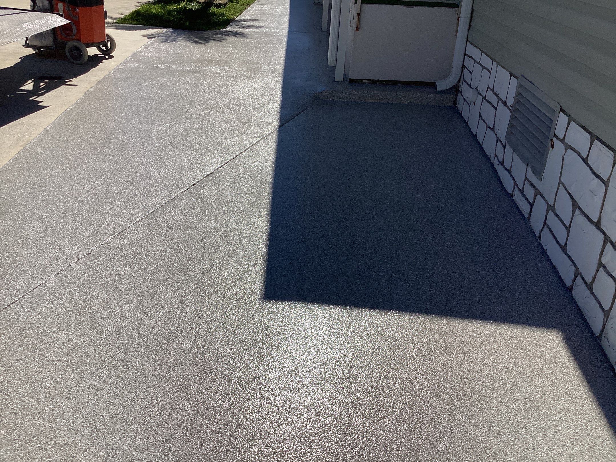 Driveway using Mt Everest by Amvet concrete coatings llc