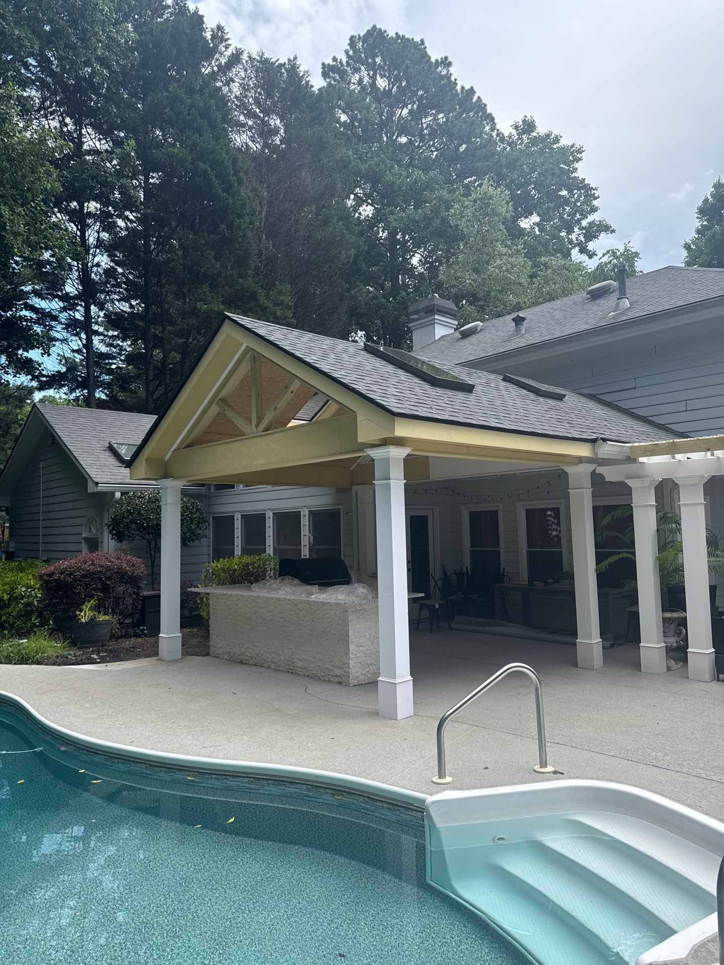 Marietta Poolside Pavilion with Custom Outdoor Kitchen and Pergola by Swift Home Renovations