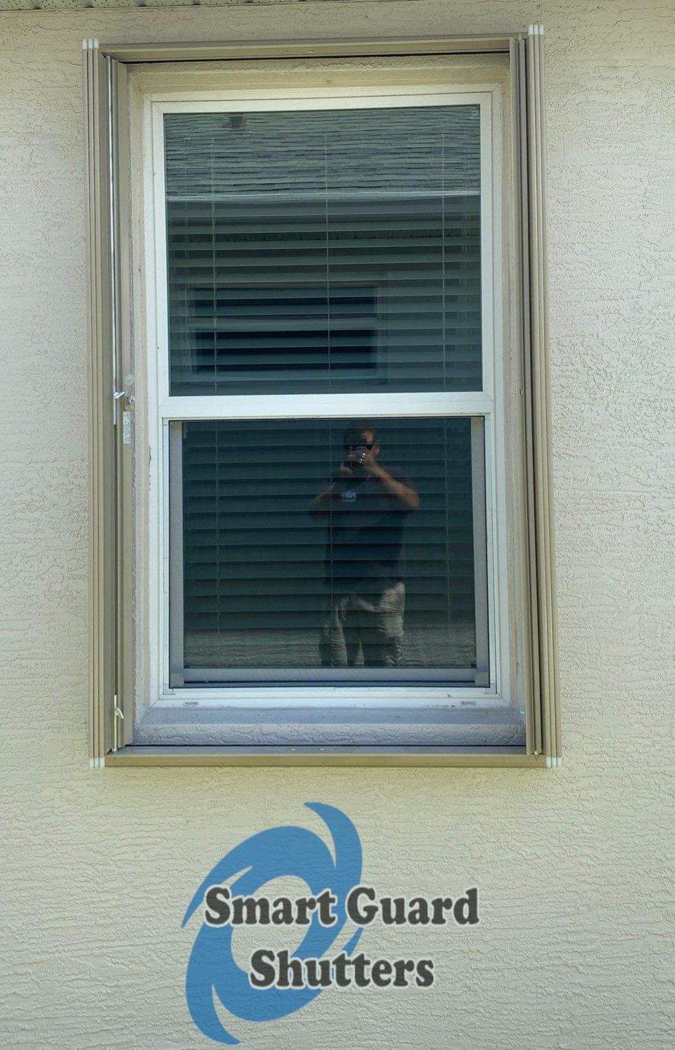 Accordion Shutters in Beige  by Smart Guard Shutters