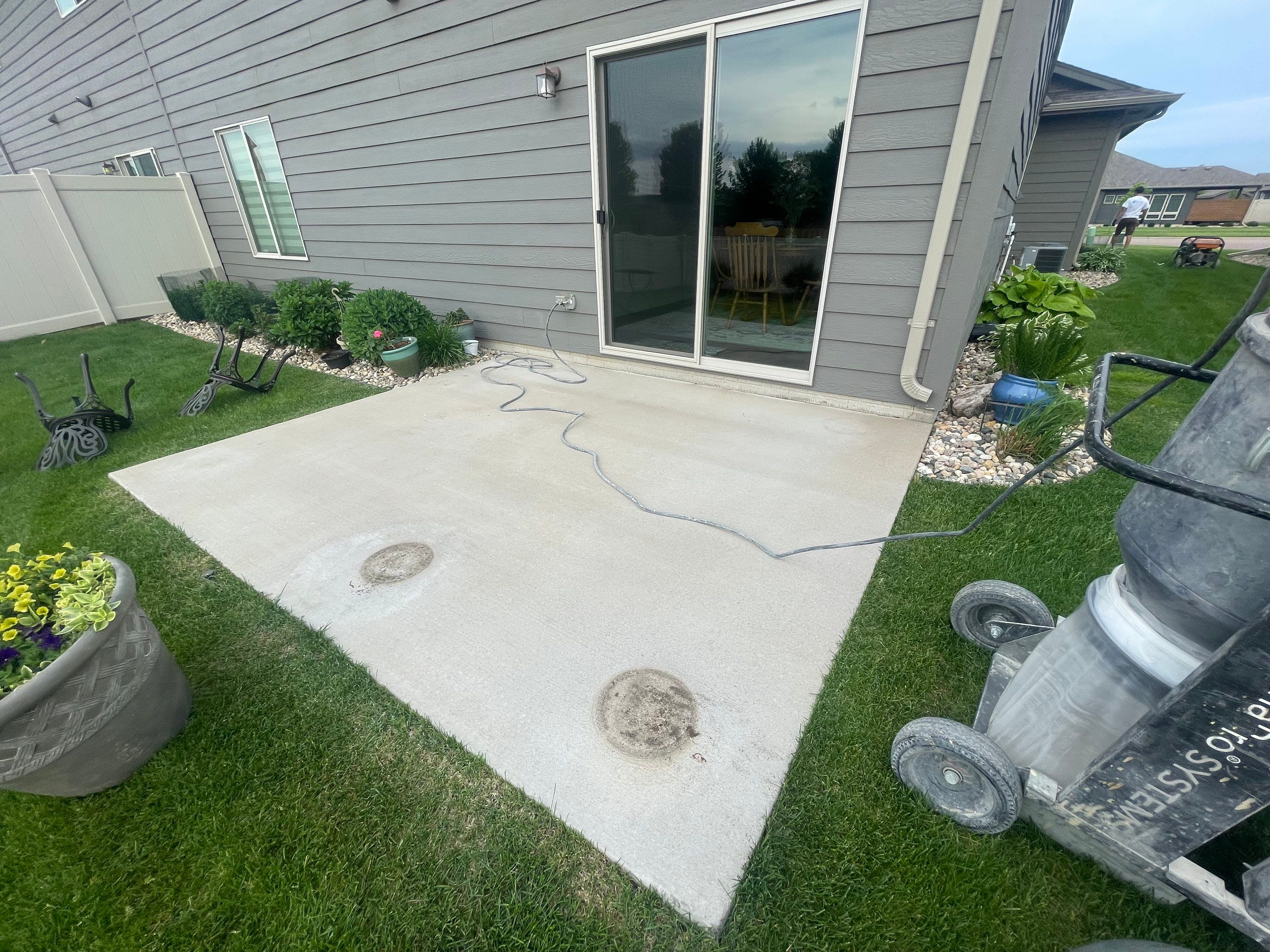 Custom Concrete Coating for Sioux Falls Patio and Front Walkway by Select Painting, Coatings & Garage Cabinets