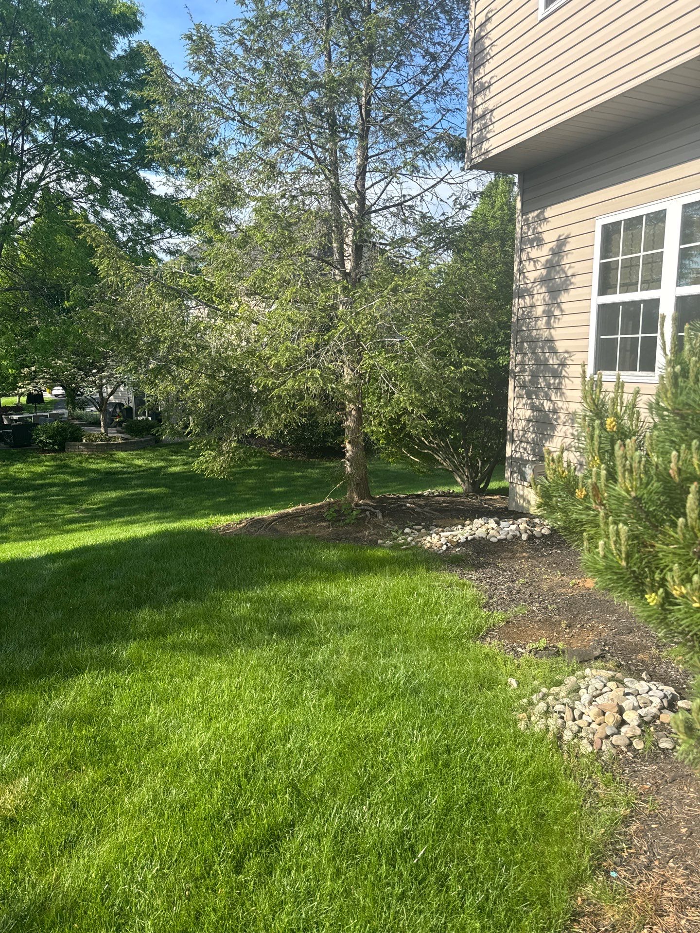 Backyard Retreat: Techo-Bloc Patio + Firepit Lounge by Saylor’s Lawn & Landscape