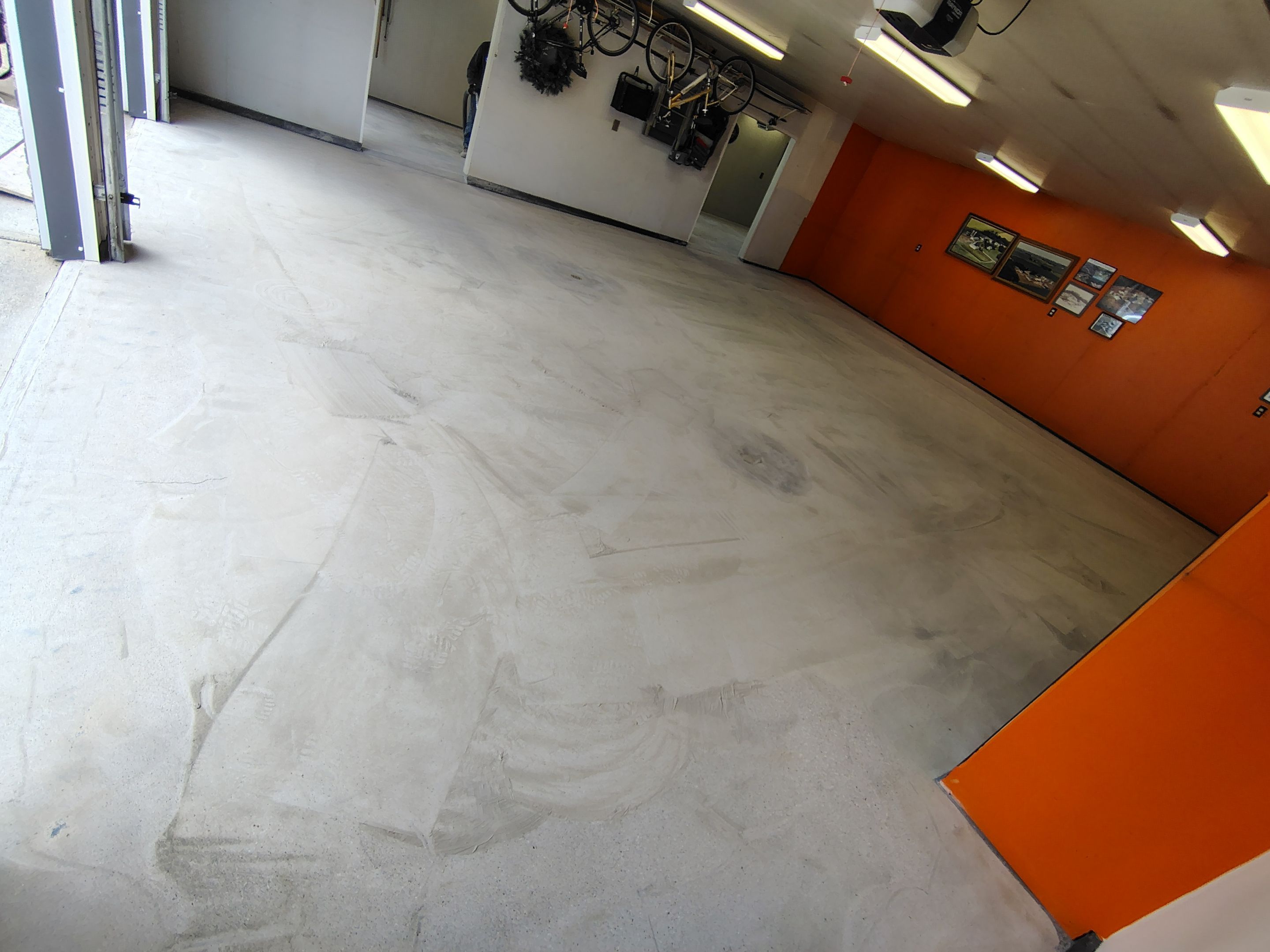 Custom Grey Flake Epoxy Garage Floor Installation in Remsen by Select Painting, Coatings & Garage Cabinets