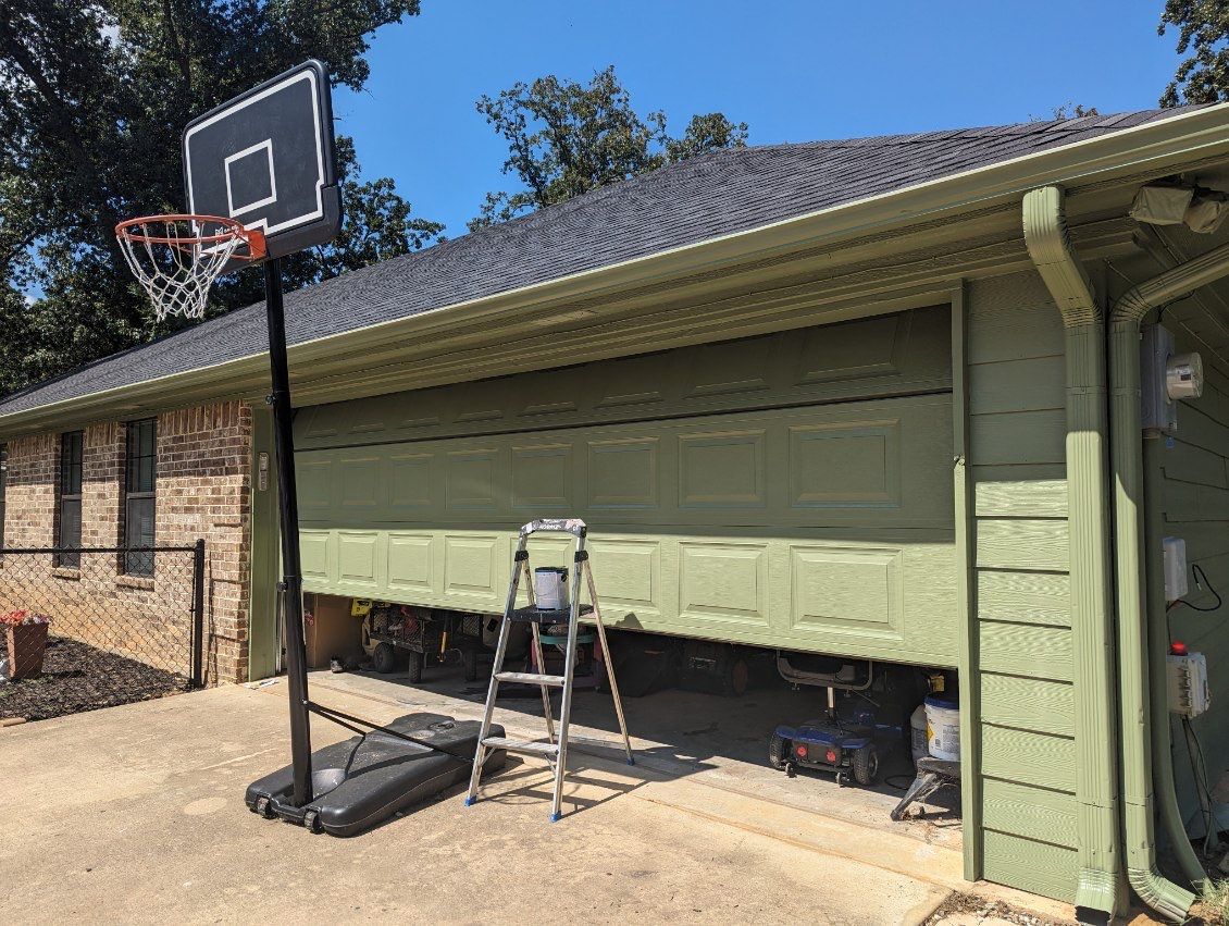 Exterior Repaint – Tyler, Texas - Bold green color with black garage by Quality Coats Painting
