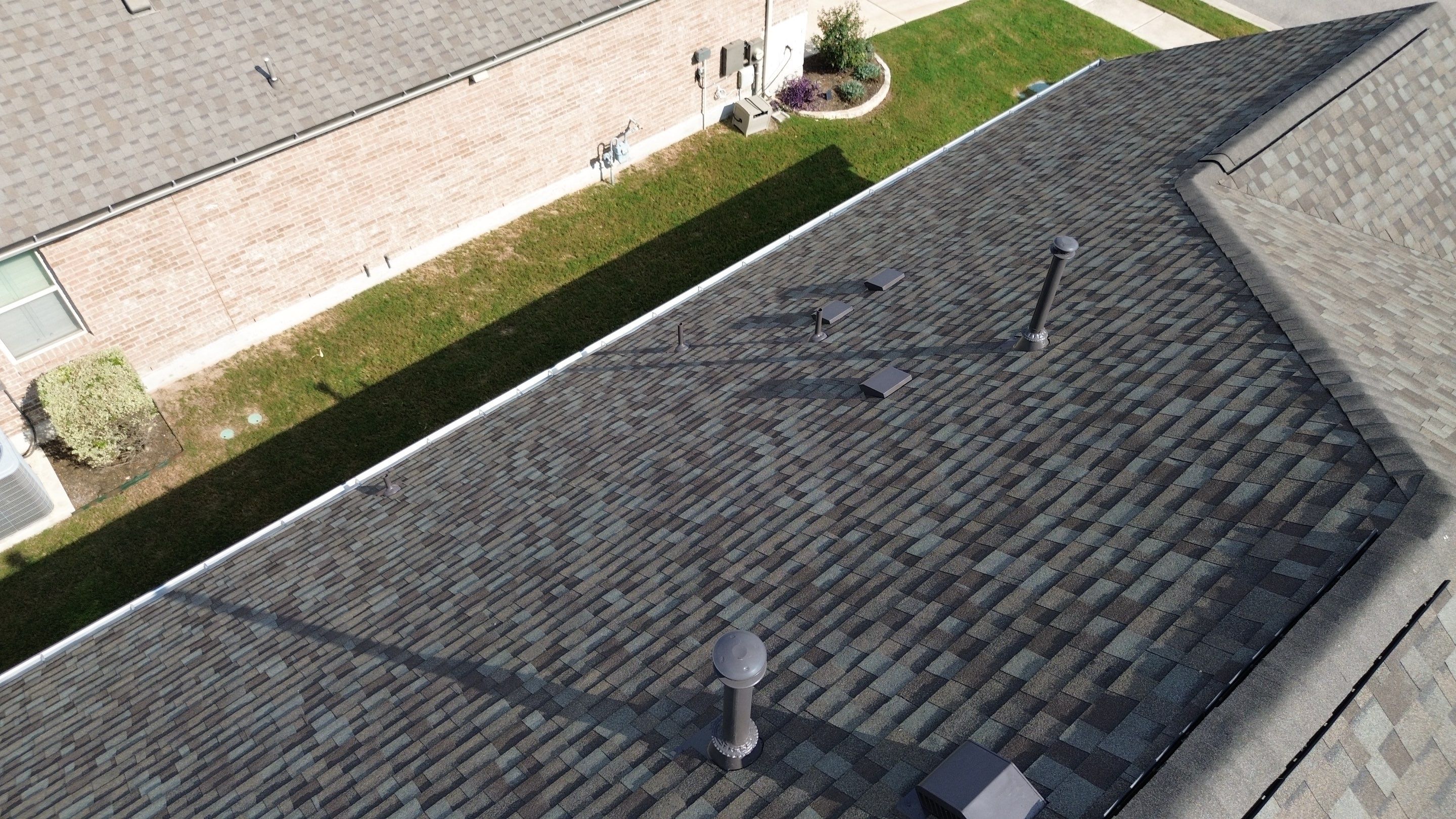 Full Roof Replacement with Solar Reinstall – Duration Driftwood | Round Rock, TX by Kstylez Roofing & Construction