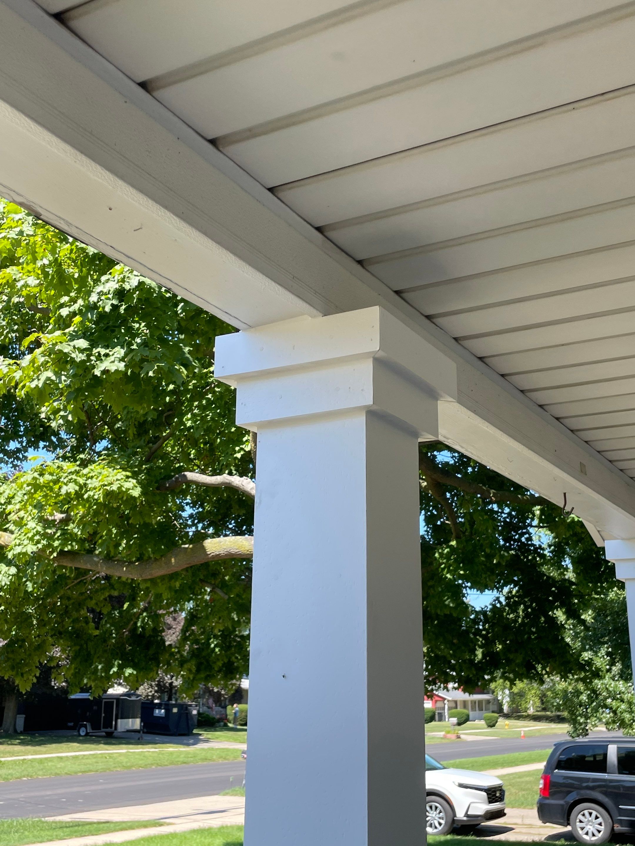 Front Porch Posts and Treated Porch Floor and Steps by Avalon Roofing and Exteriors