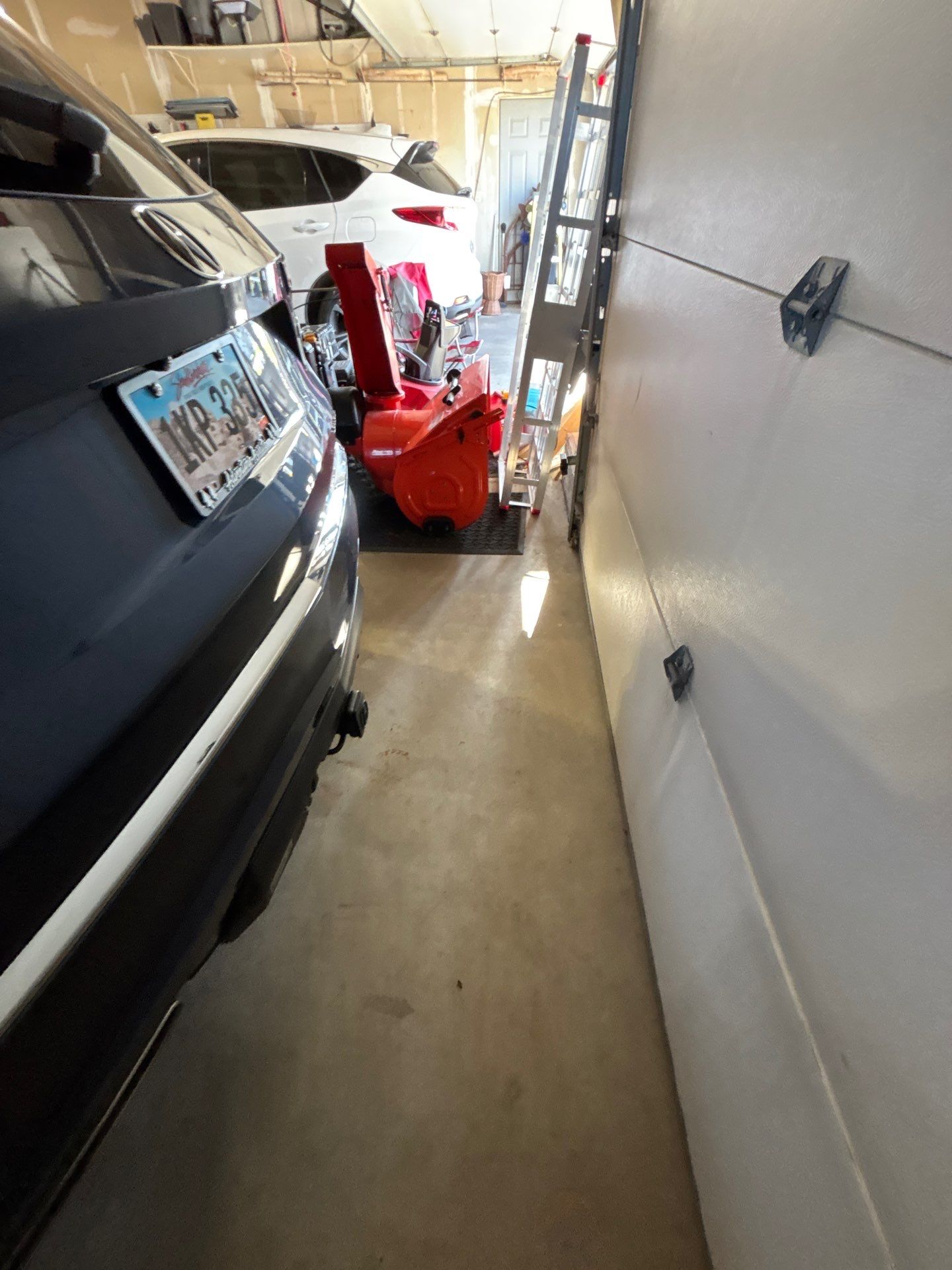 Sioux Falls Garage Concrete Repair and Epoxy Flake Floor Coating by Select Painting, Coatings & Garage Cabinets