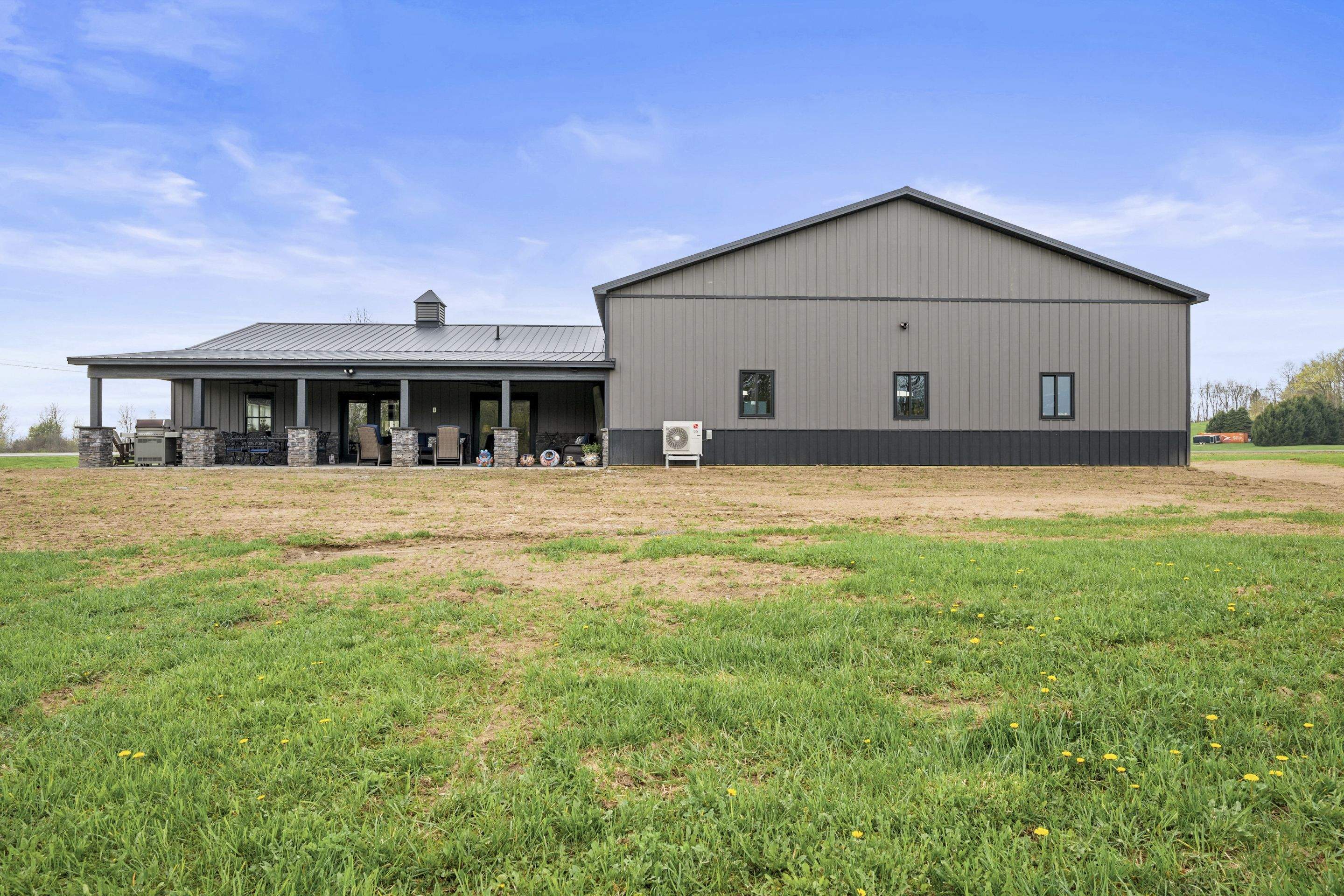 Barndominium  using Textured Board & Batton by Horst Custom Homes 