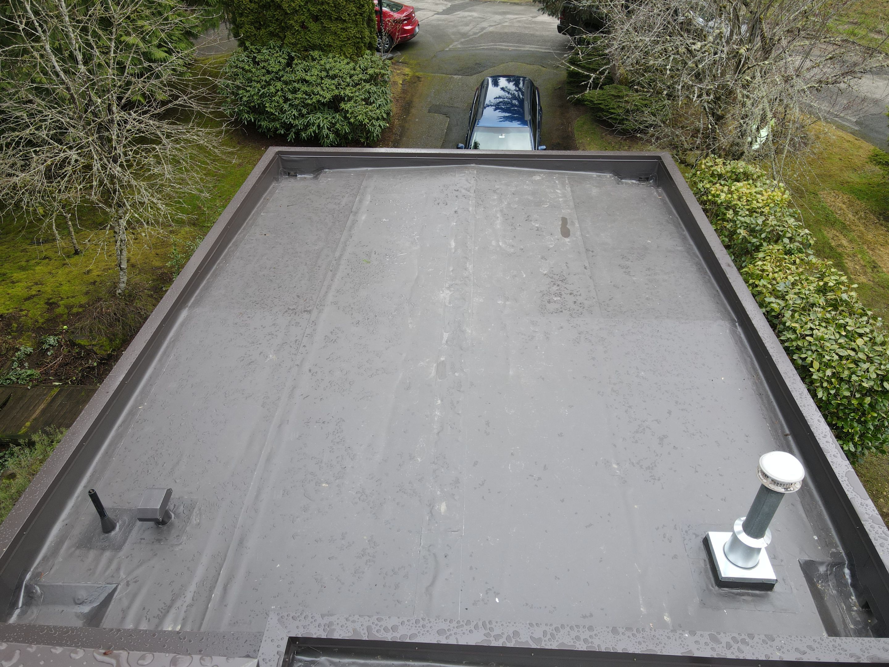 Flat Roof Replacement in Redmond with Custom Skylight using Duro-Last PVC by RoofSmart
