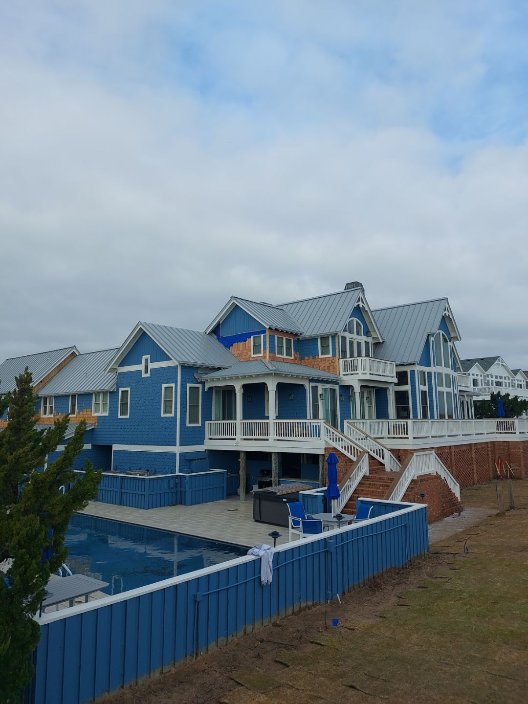 Large Metal Roof Transformation by Gallop Roofing & Remodeling, Inc.