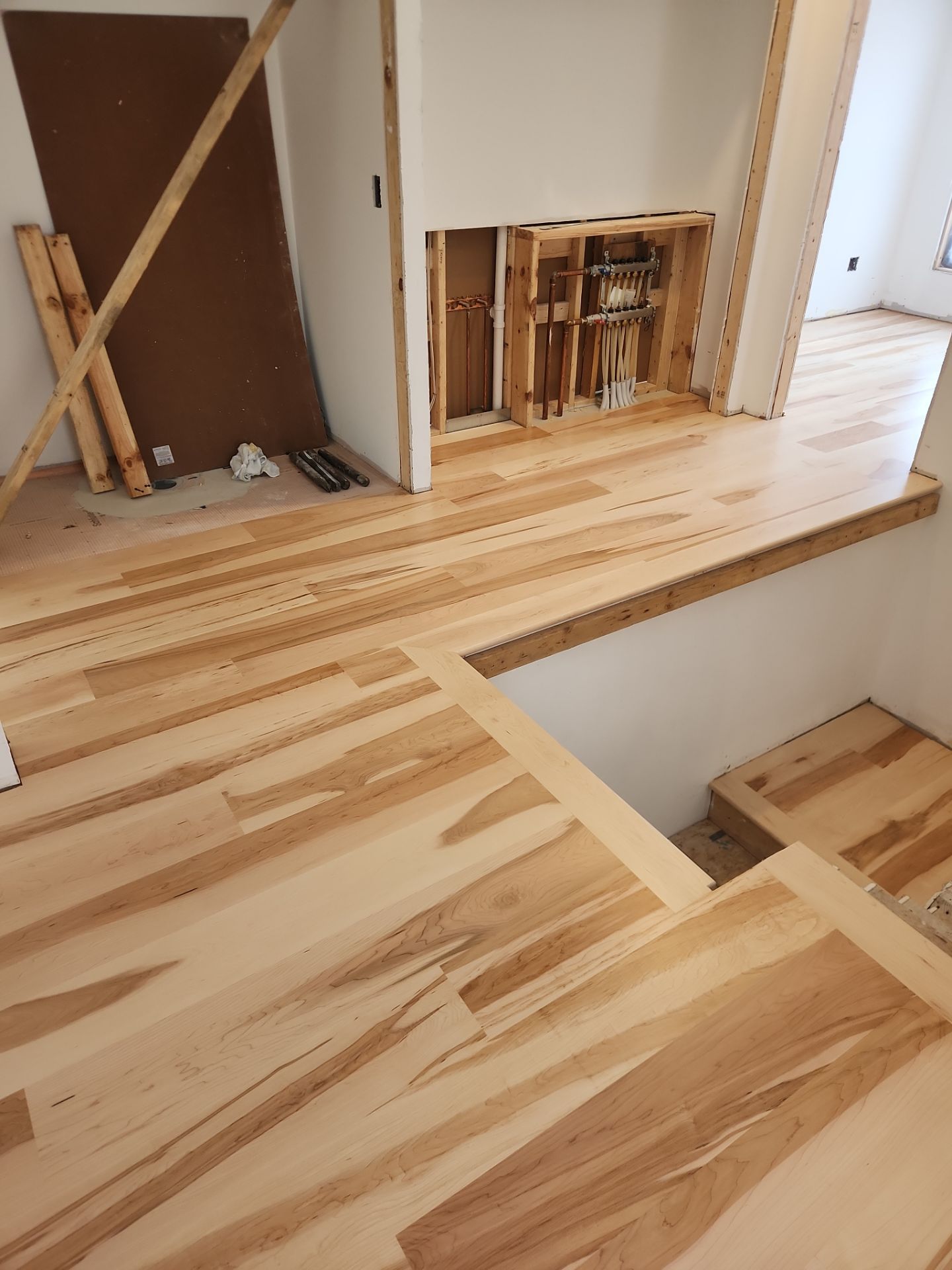 Full glue down Installation over radiant heat 7" Maple character grade by Ann Arbor Hardwoods 
