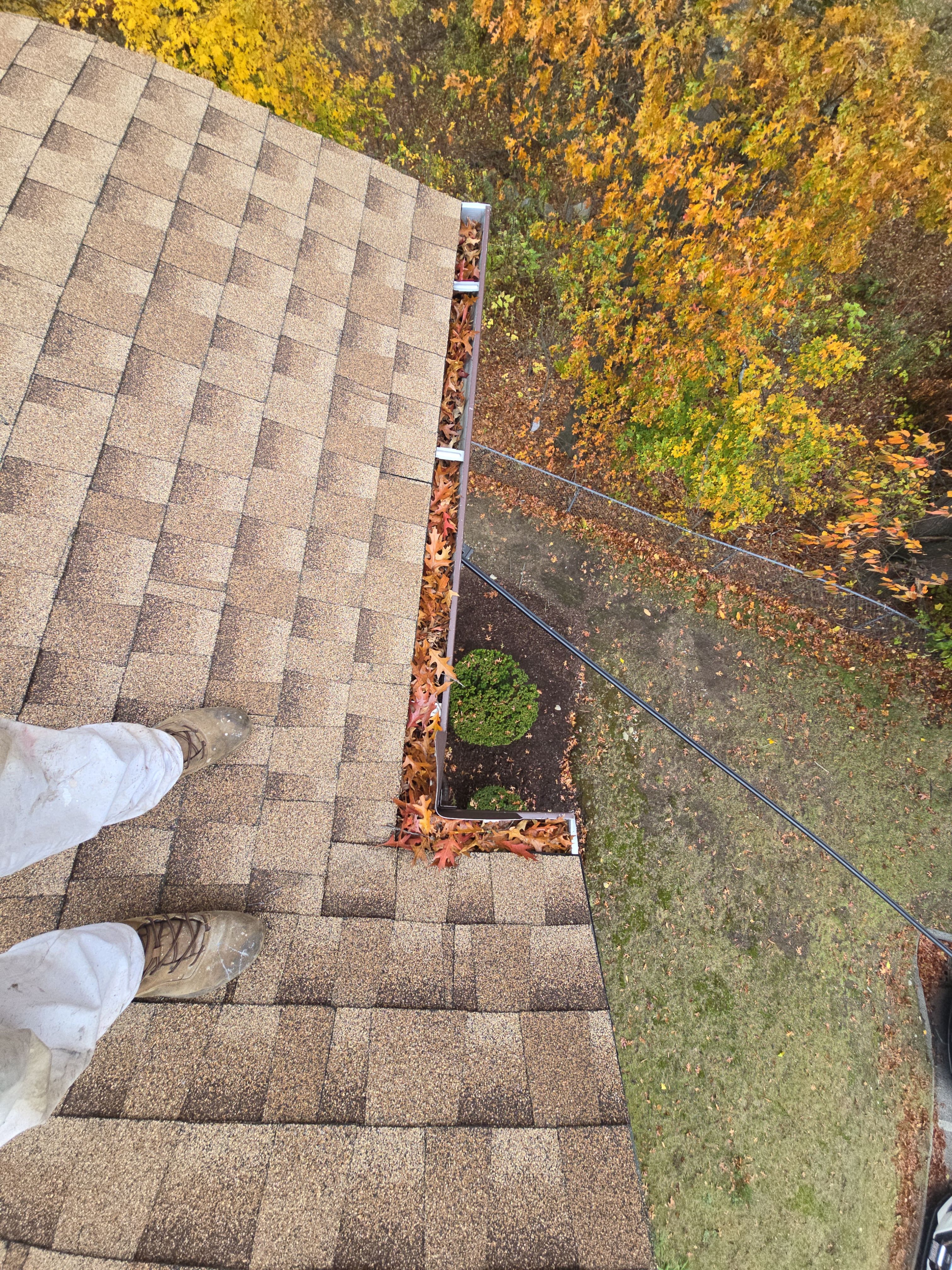 Commercial gutter cleaning Massachusetts before photo with filled gutters