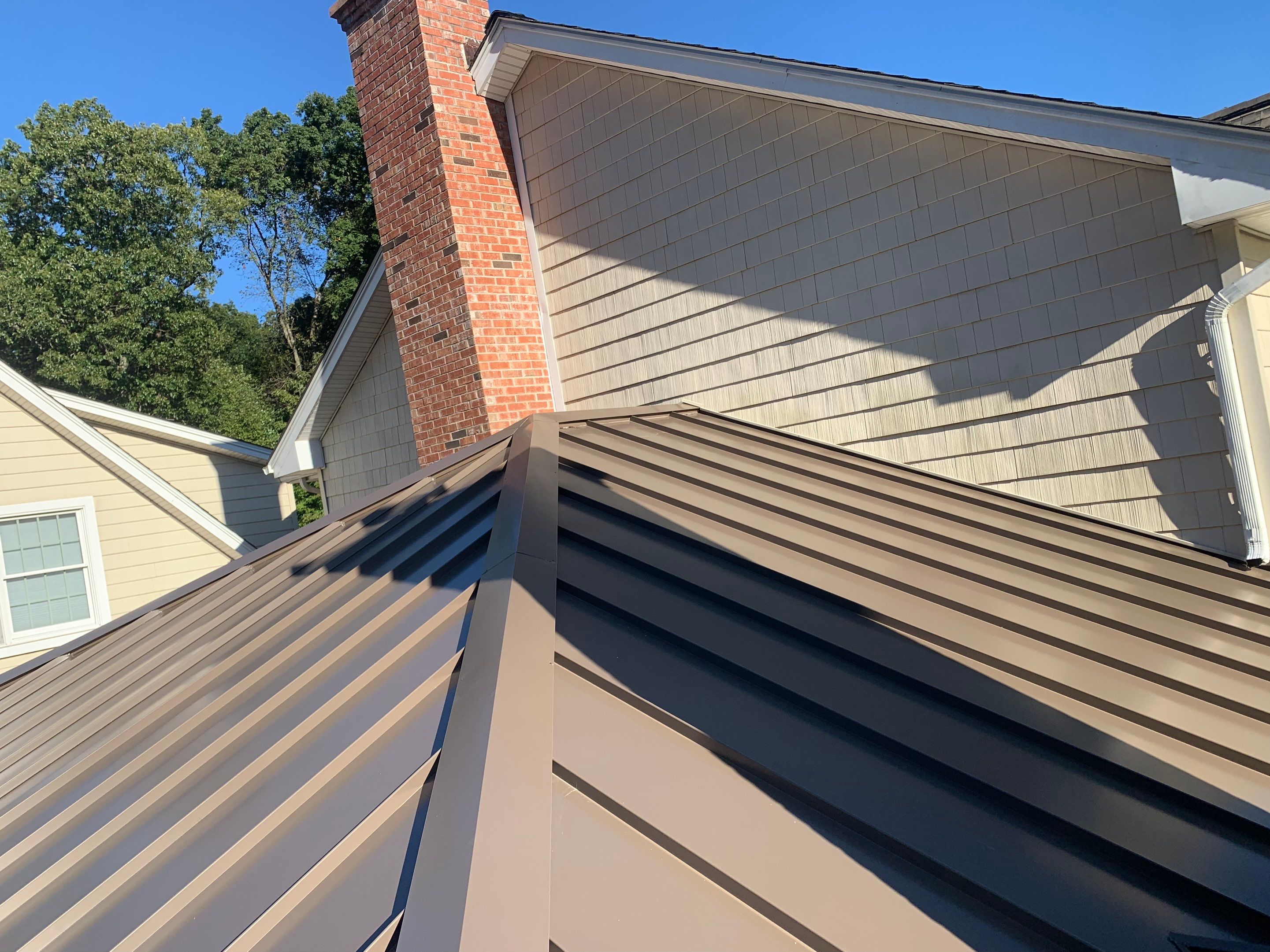 Asphalt & Standing Seam Metal Roof Replacement by Lecla Home Improvements and Roofing INC