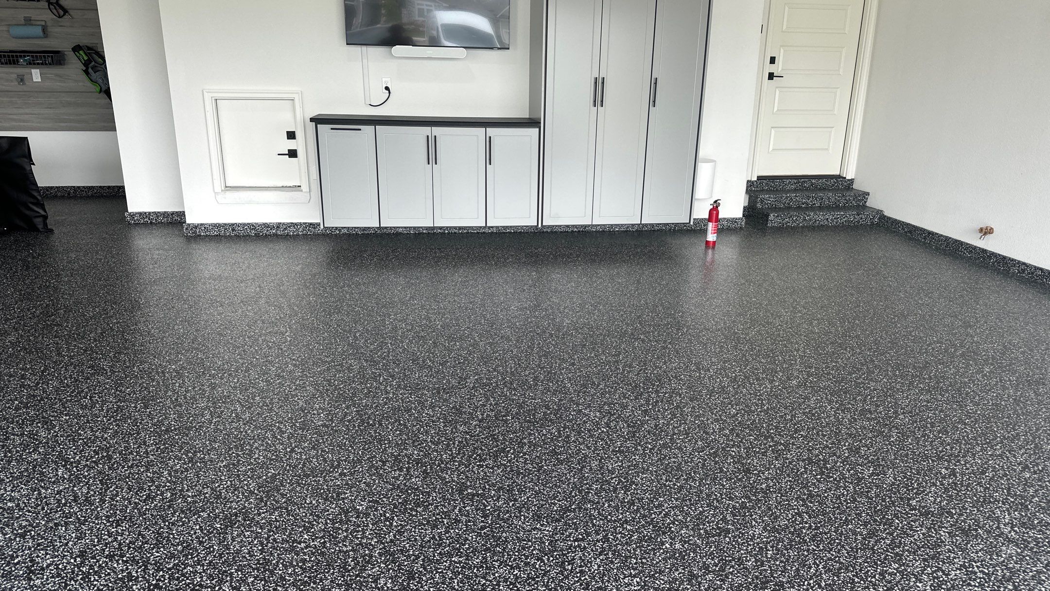 John H. received his dream garage with cabinets and a Banner Garage Floor by Banner Garage