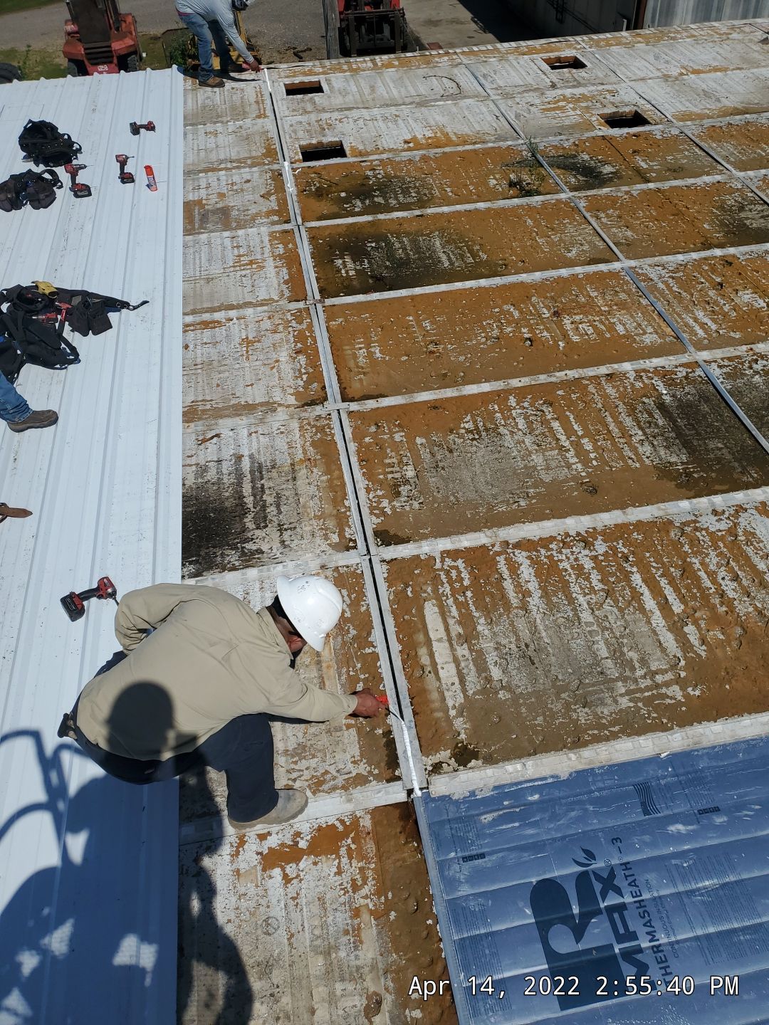 Commercial Roofing Installation using Aluminum Roofing panels by Hostetler Roofing