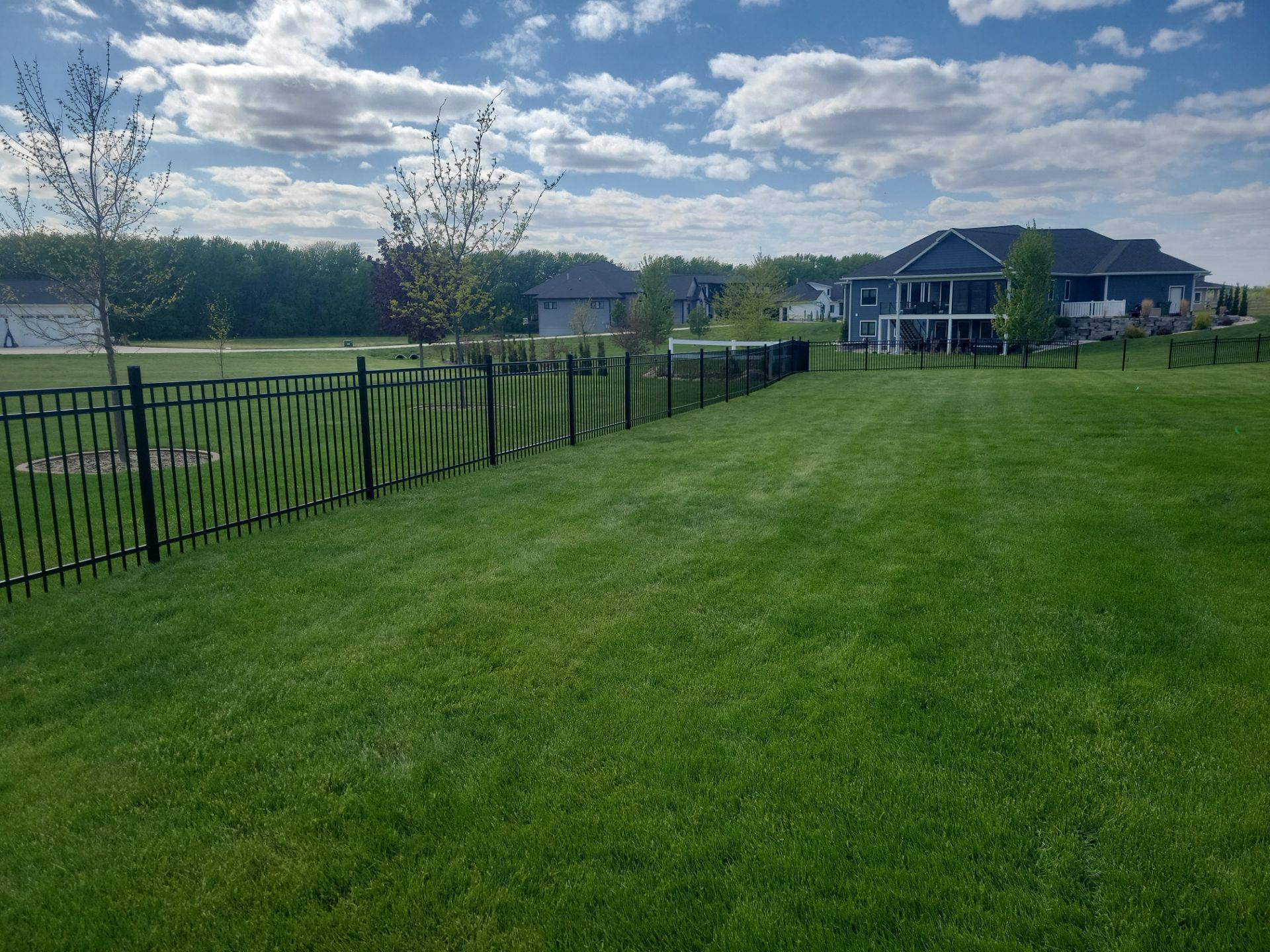 Black Ornamental Metal Picket Fence Installation in Waterloo by Perfect Picket Fence and Stain
