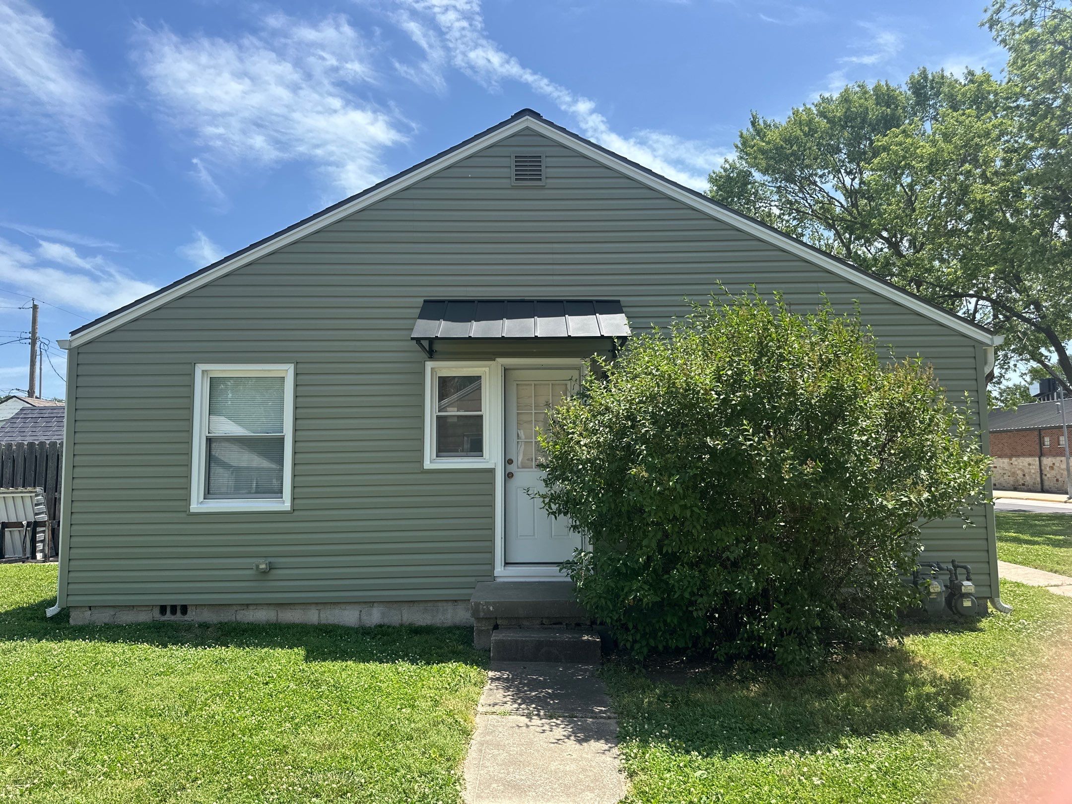 New Cypress Siding going on this North Kansas City Home  by EEC  Windows, Siding & Roofing 