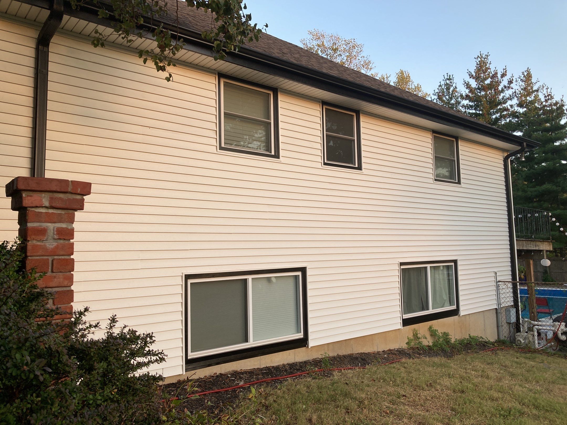 New white siding with Black trim by EEC  Windows, Siding & Roofing 