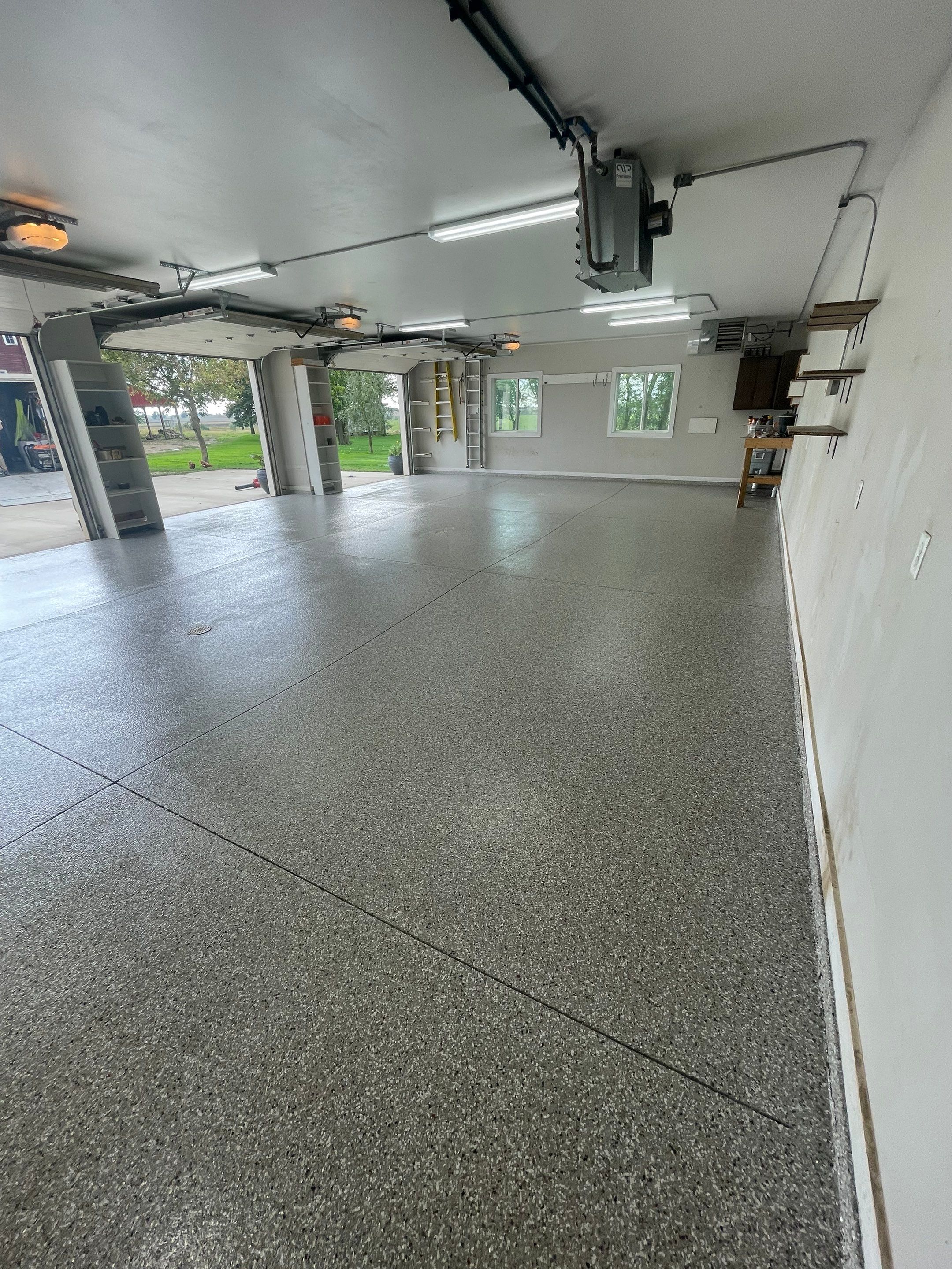 Grey Speckled Polyuera Garage Floor Coating for Hartford Three-Car Garage by Select Painting, Coatings & Garage Cabinets