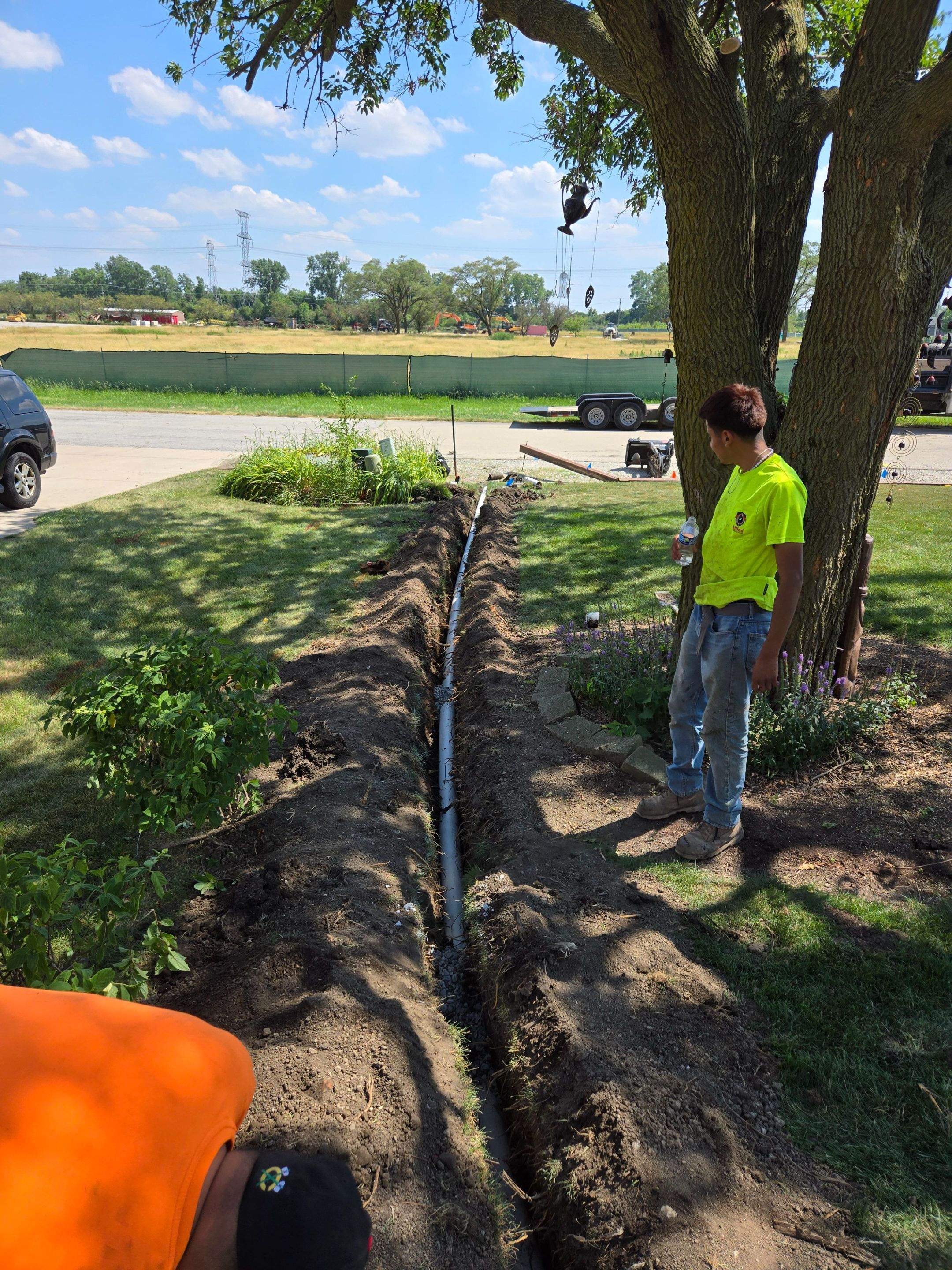 Burial of Sump Pump and Down Spout Discharges and Partial Waterproofing of Wall by Allied Water Services