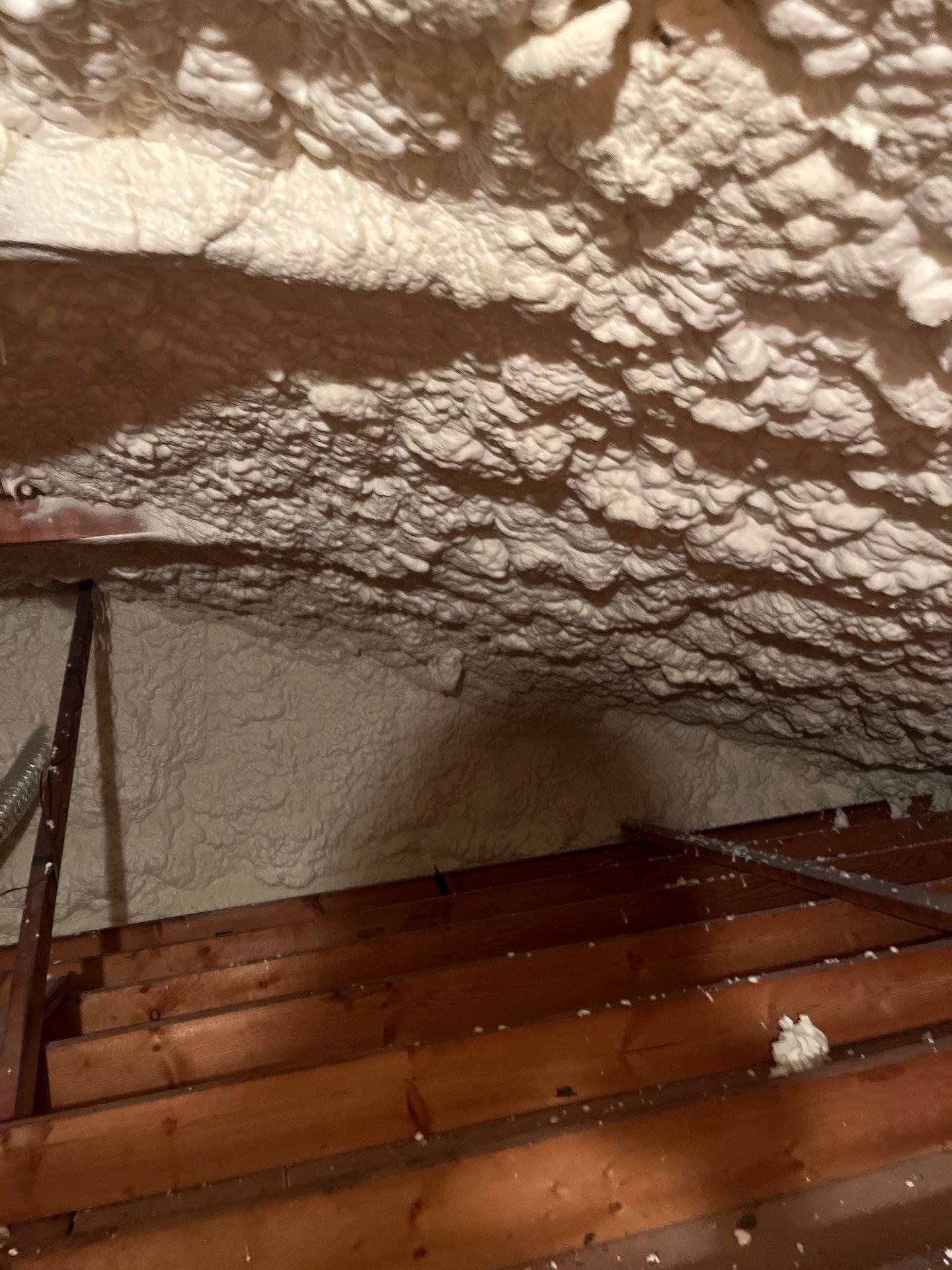 Garage ceiling using open cell spray foam by NYS Foam & Energy