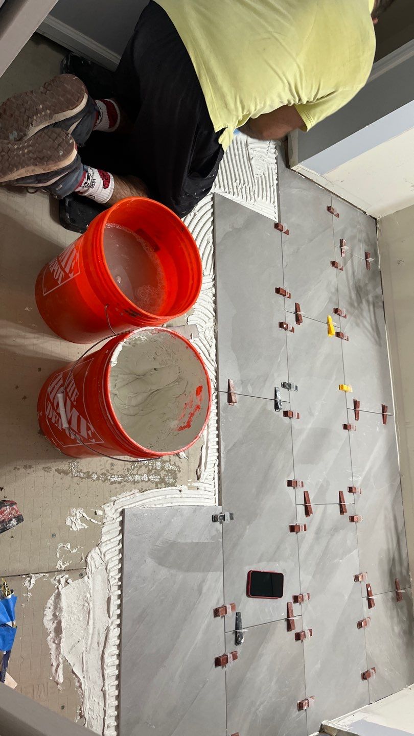 Tub to walk-in shower conversion, and tile flooring by Prudencio