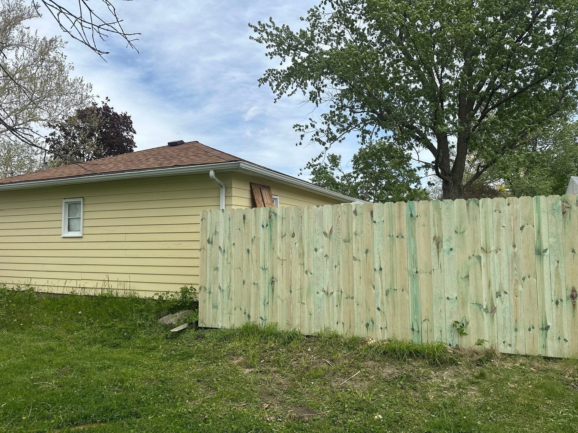 Pressure-Treated Wood Privacy Fence Installation in Waterloo by Perfect Picket Fence and Stain