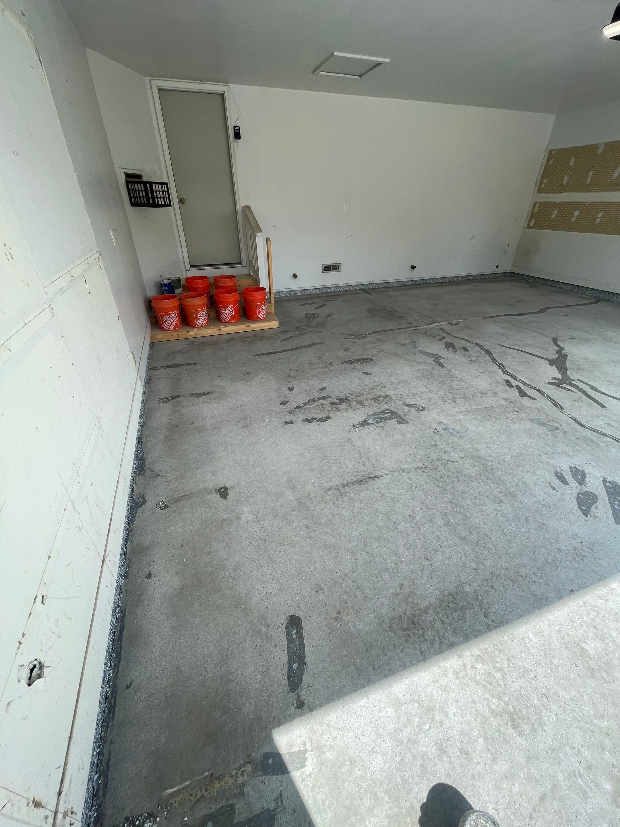 Grey Speckled Concrete Coating for Residential Garage in Yankton by Select Painting, Coatings & Garage Cabinets