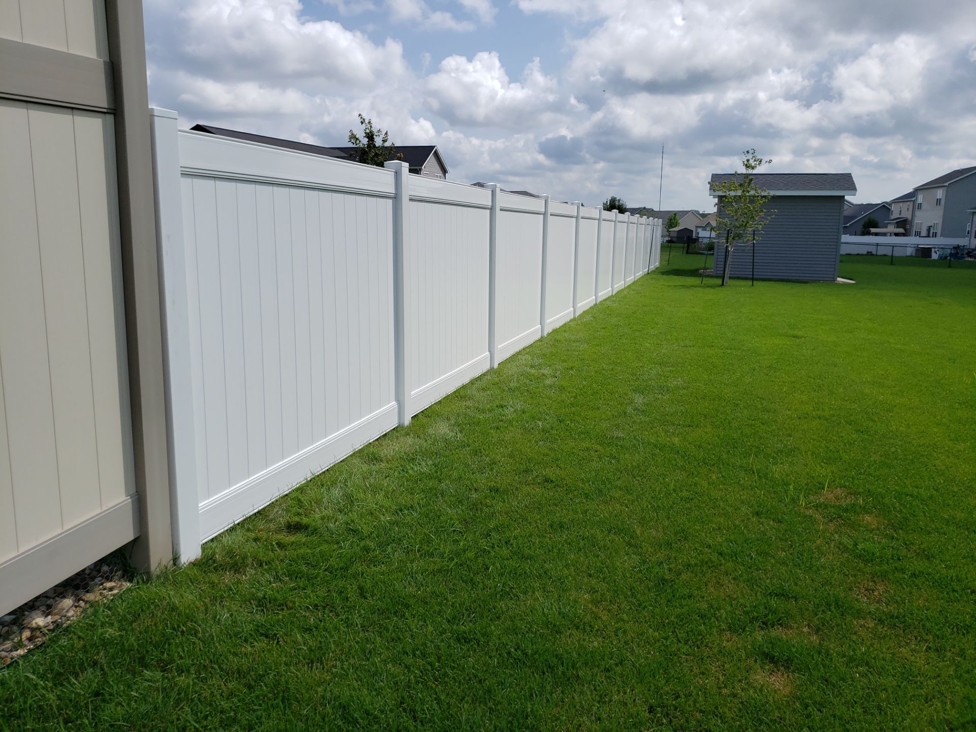 New Vinyl Privacy Fencing and Gates for Waterloo Residential Backyard by Perfect Picket Fence and Stain