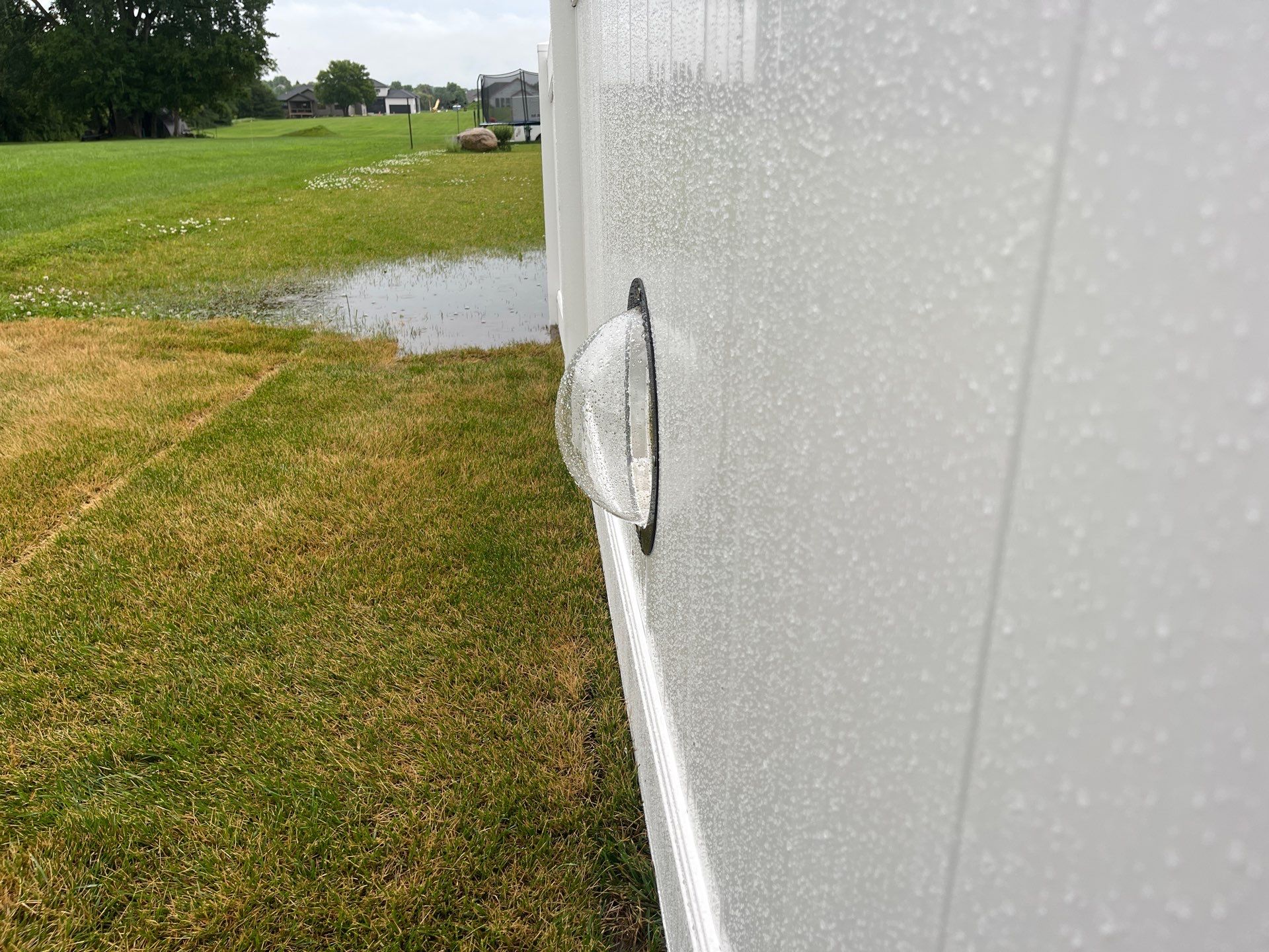 White Vinyl Privacy Fence With Pet Window in Cedar Falls by Perfect Picket Fence and Stain