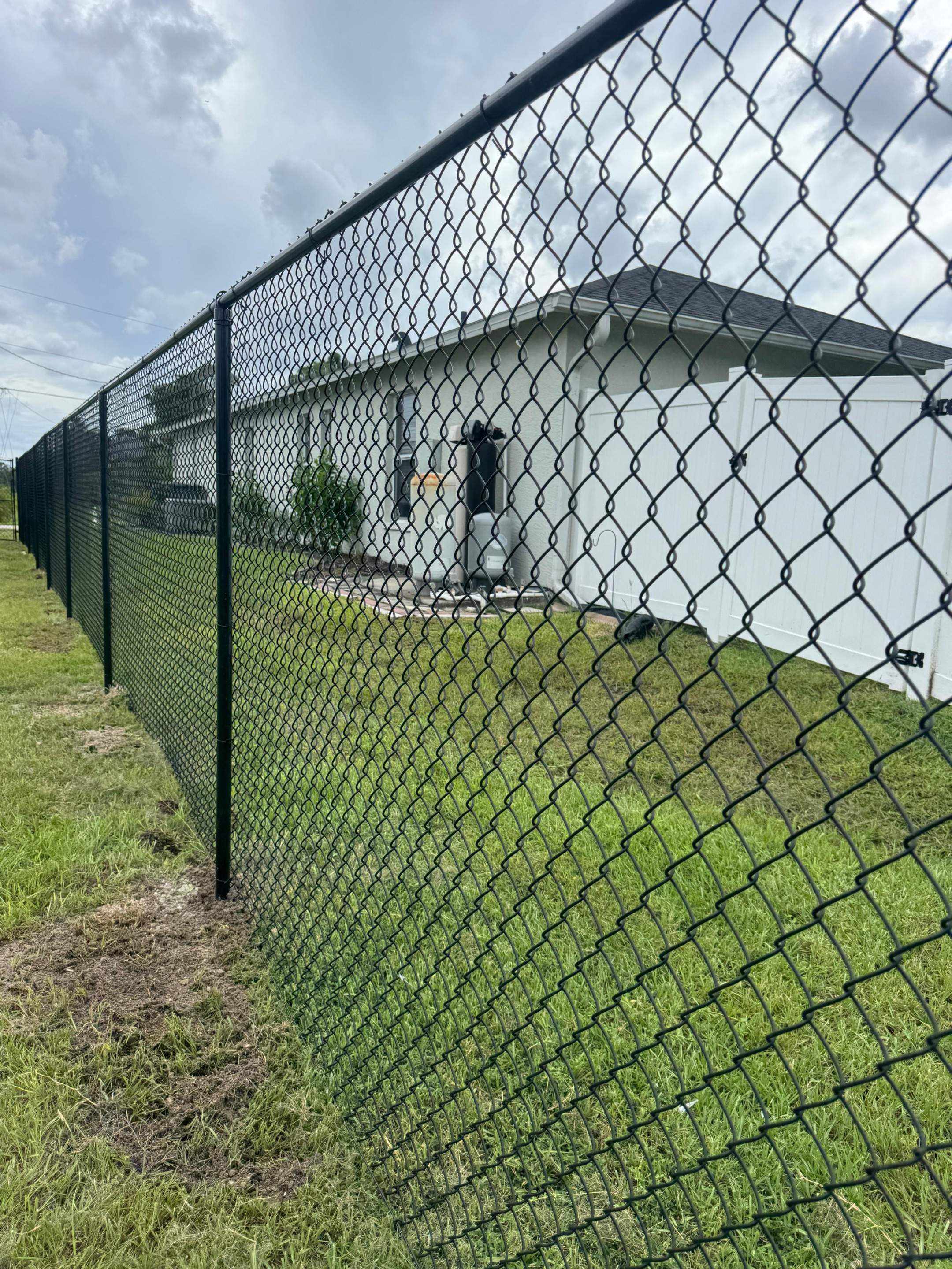 Residential Black Chain Link Fence Installation in North Port by True Fence LLC