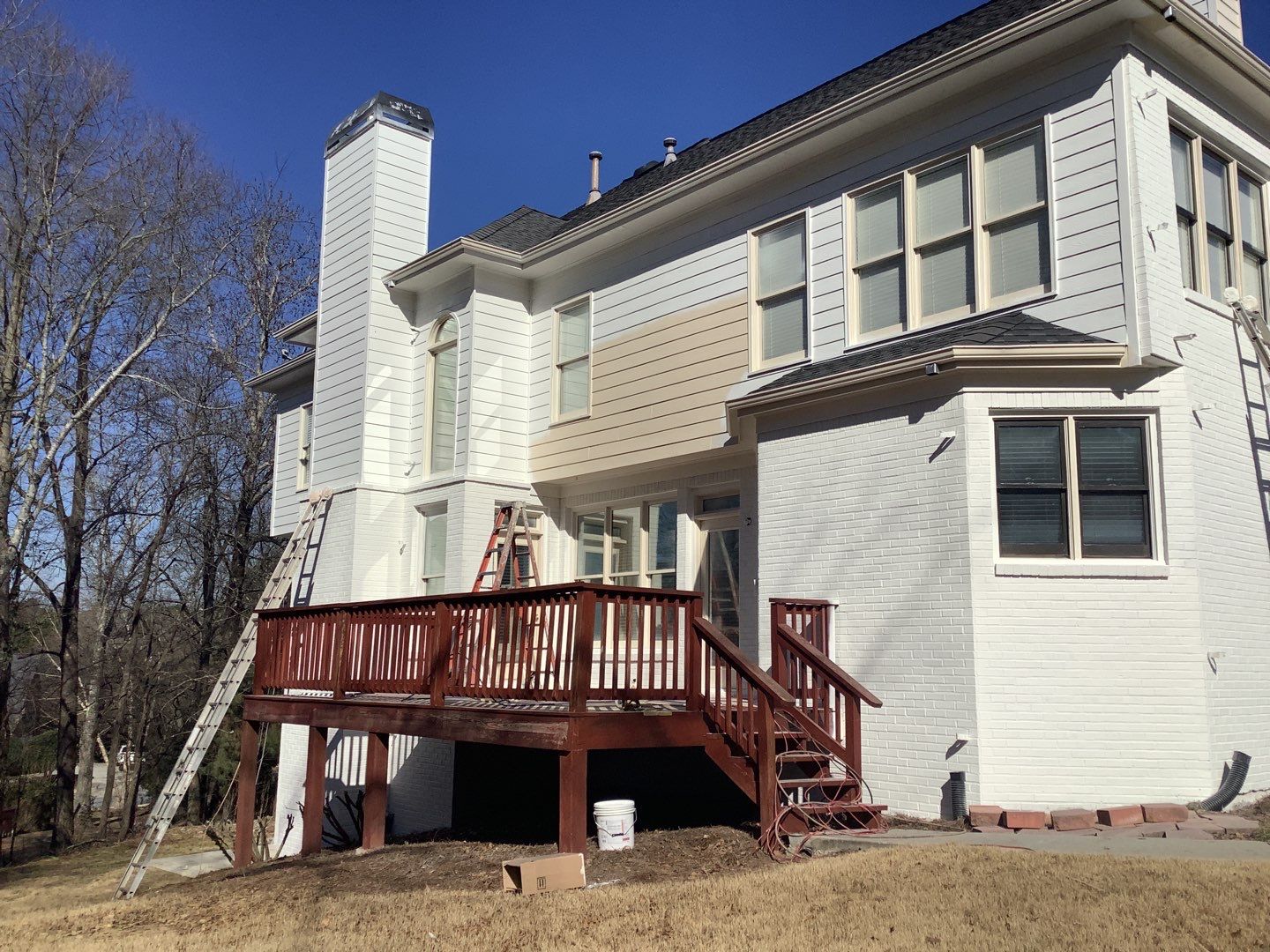 White Brick Exterior Painting and Deck Refinishing in Duluth by Swift Home Renovations