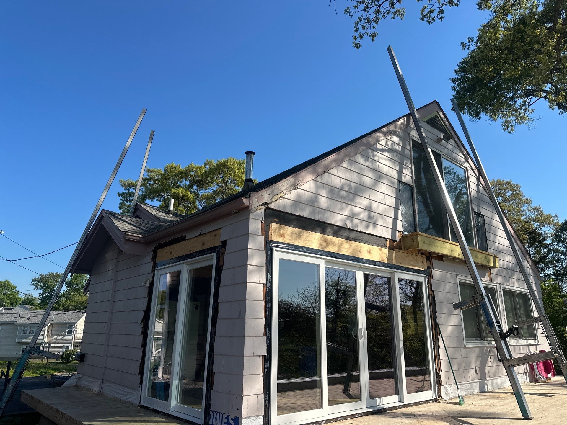 Milford Exterior Renovation Featuring Custom Siding and Wood Deck Installation by A Plus Exterior