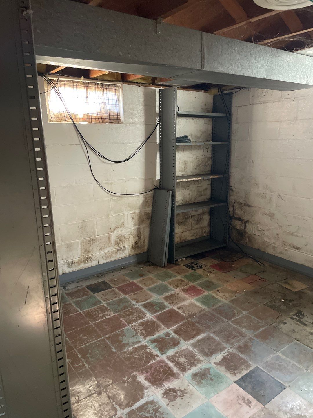 Interior drain tile system installation by ACE Waterproofing & Basement Solutions