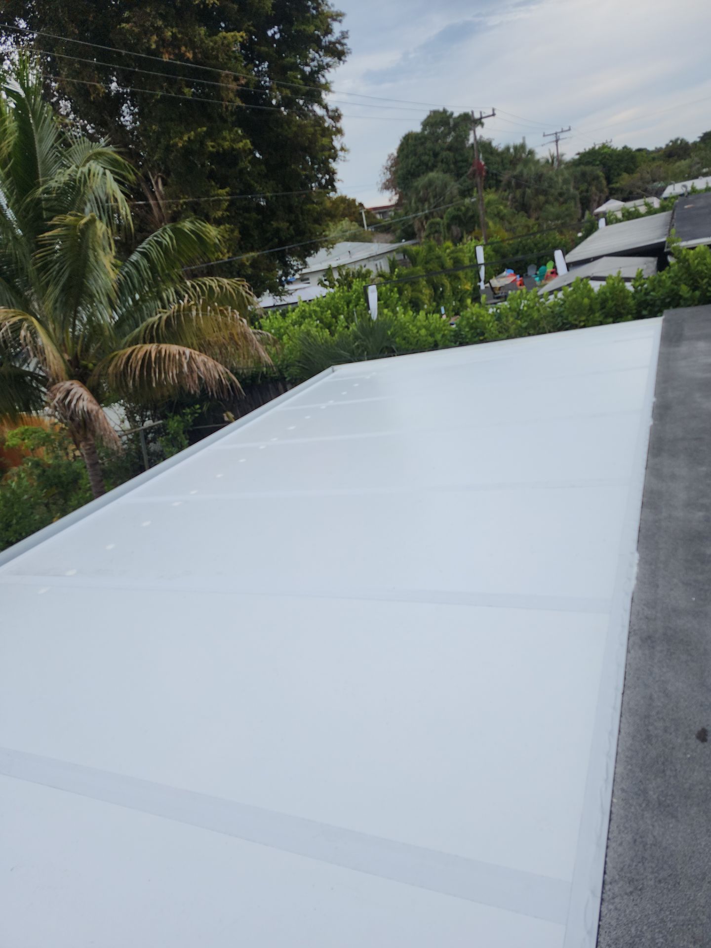 Insulated Screen Enclosure and Wood Tile Deck Installation in Plantation by Aastro Roofing