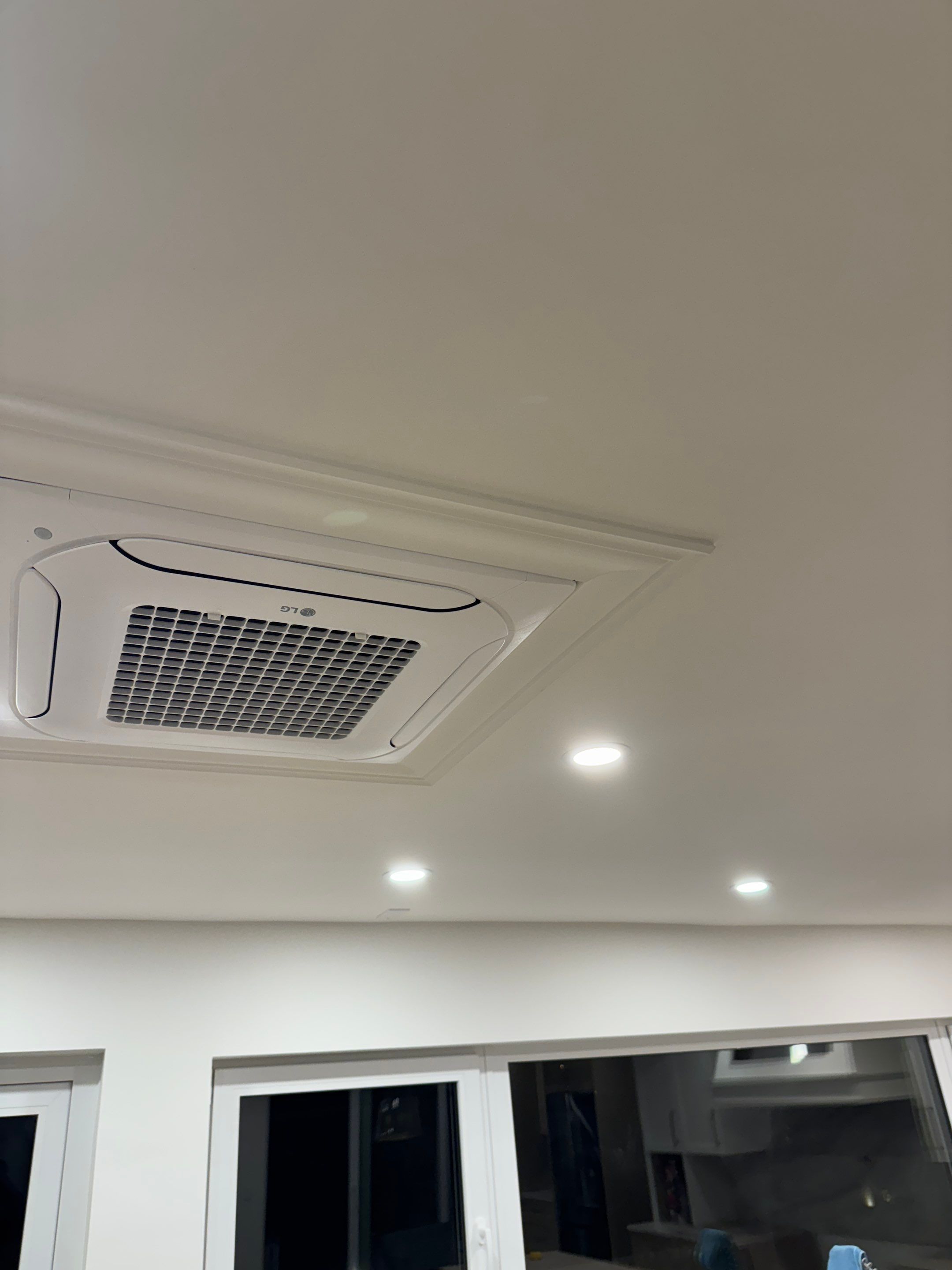 West Vancouver Custom Millwork: Heat Pump Trim & Window Finishing by YVR Construction Group