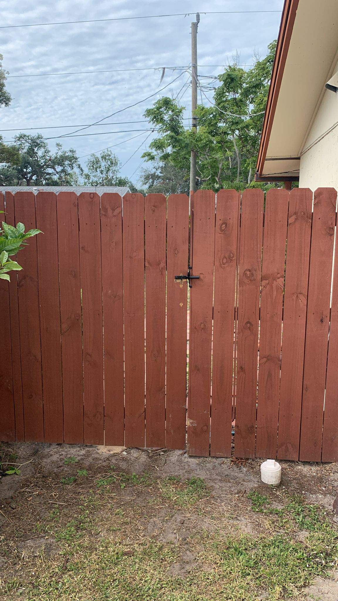 Red-Stained Wood Privacy Fence and Gate Repair in Venice by True Fence LLC