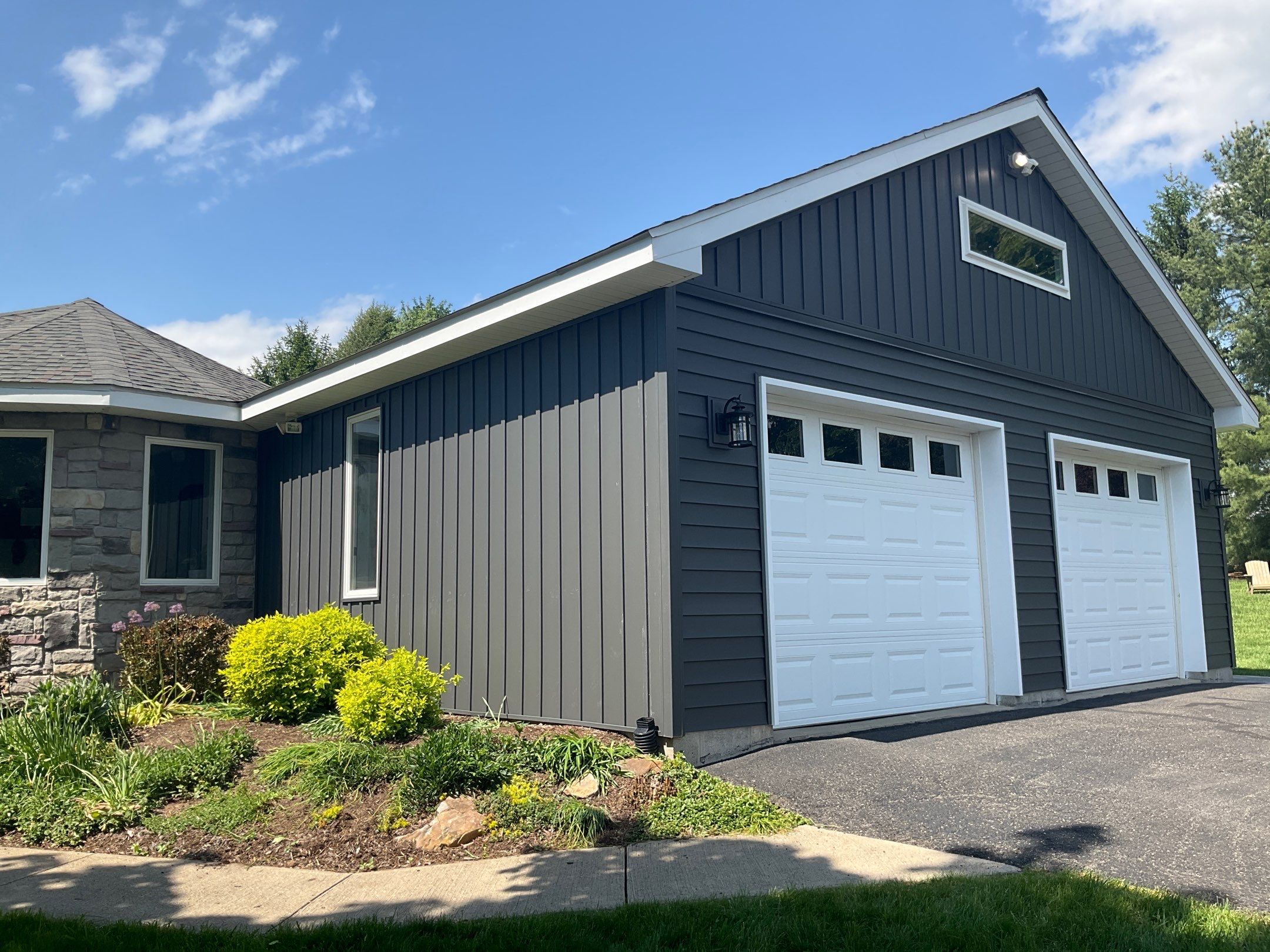 Nightfall Exterior Siding Replacement and Stone Veneer in Halifax by Esh Builders