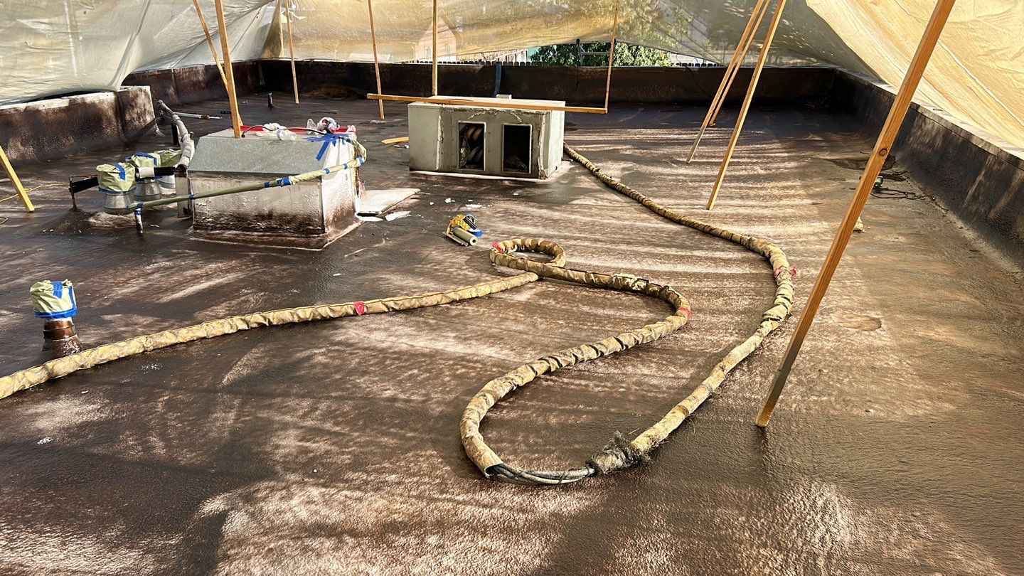 Foam Refurbish using Conklin Benchmark/PUMA XL coatings and spray foam; Also metal roofing around parapet wall by Straight Edge Roofing Inc