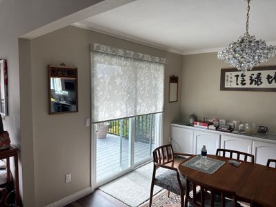 Custom Roller Shade and Floral Pattern Window Covering Installation in Solana Beach