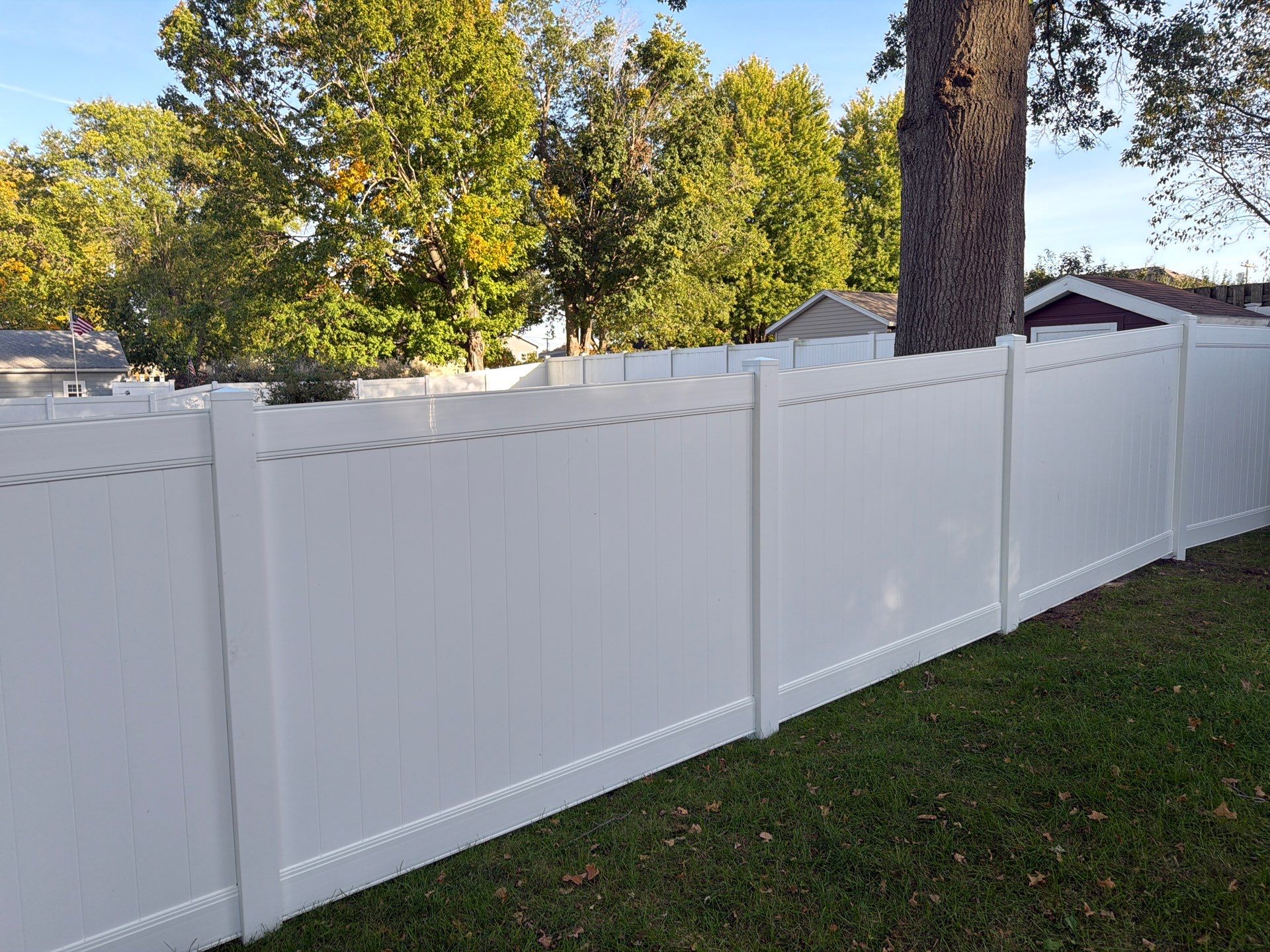 White Vinyl Privacy Fence and Gate Installation in Grundy Center by Perfect Picket Fence and Stain