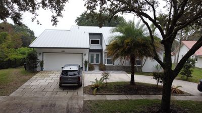 Residential Roofing Installation using 1" Nail strip metal roof