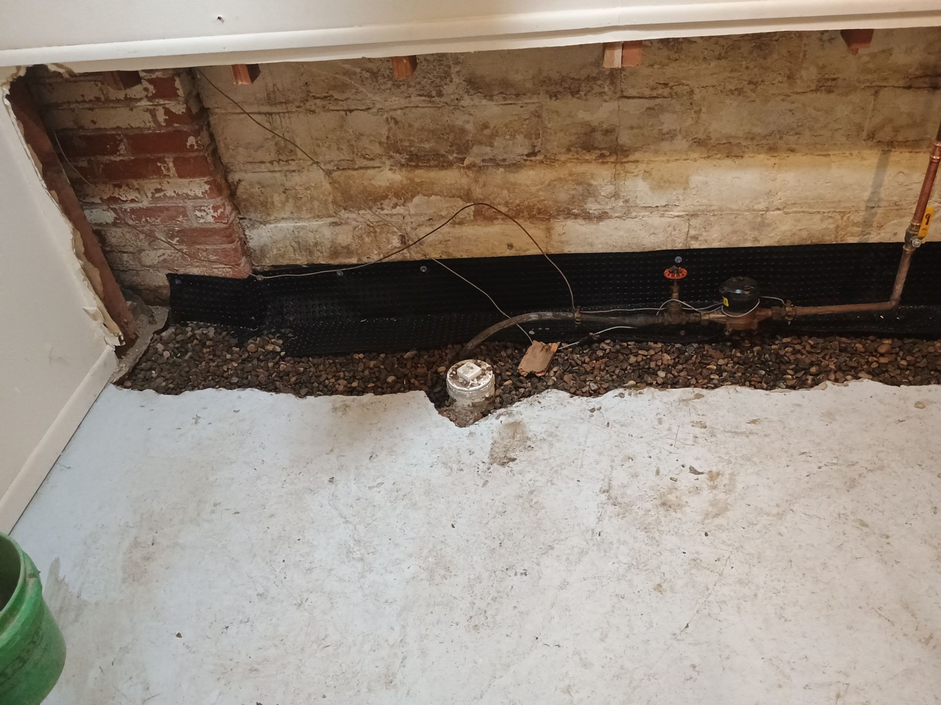 Interior Drain Tile & Sump Pump Installation in St. Paul, MN by Waterproofing Northeast