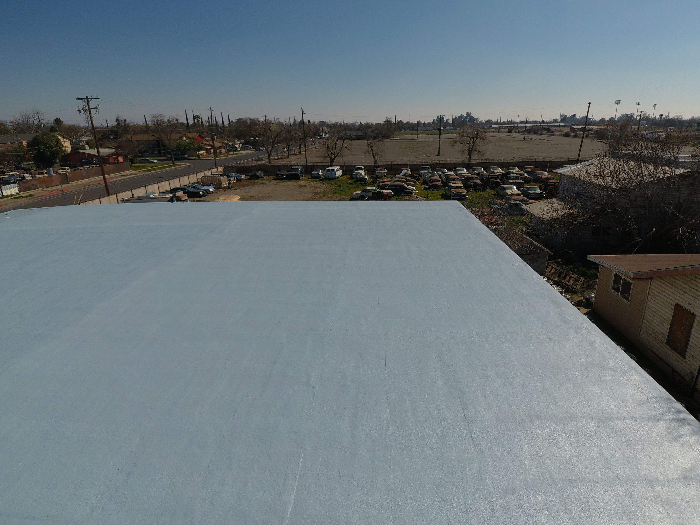 Spray foam and coatings using Conklin Benchmark/PUMA XL coatings and spray foam by Straight Edge Roofing Inc