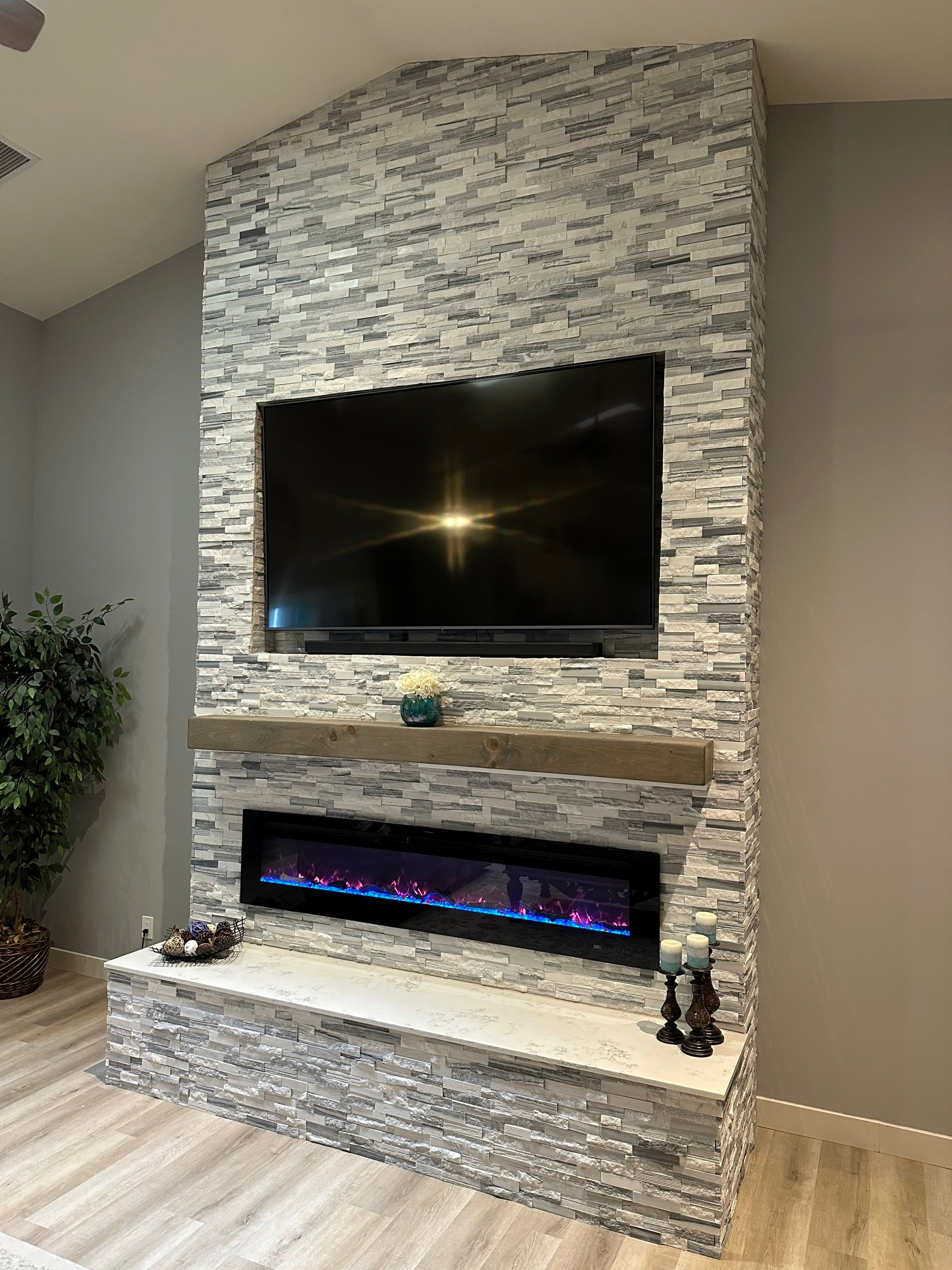 Stacked Stone Electric Fireplace by Footprints Floors of Chandler 