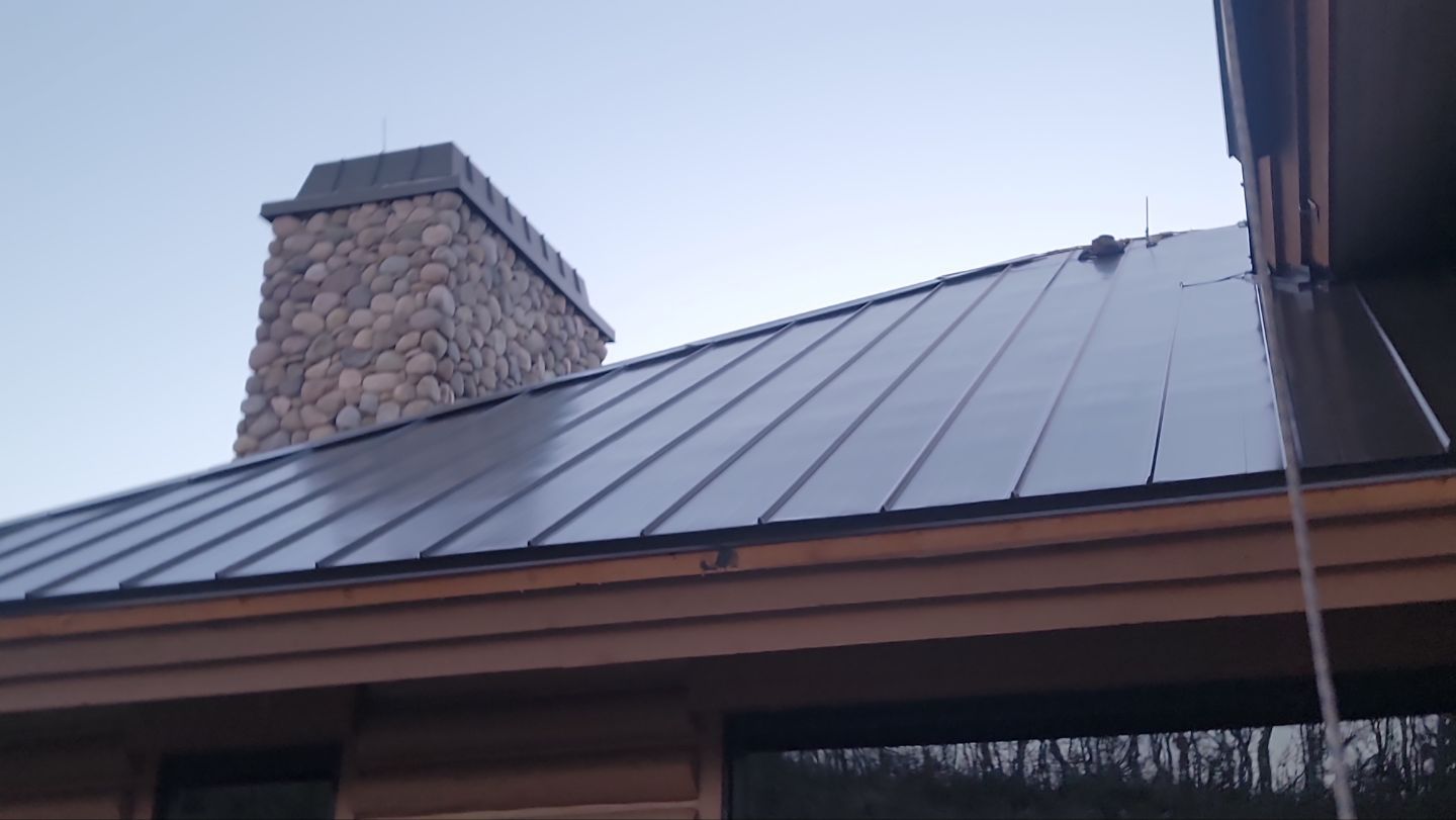 Standing Seam Metal Roof Replacement After Snow Damage by ASAP Roofing & Restoration