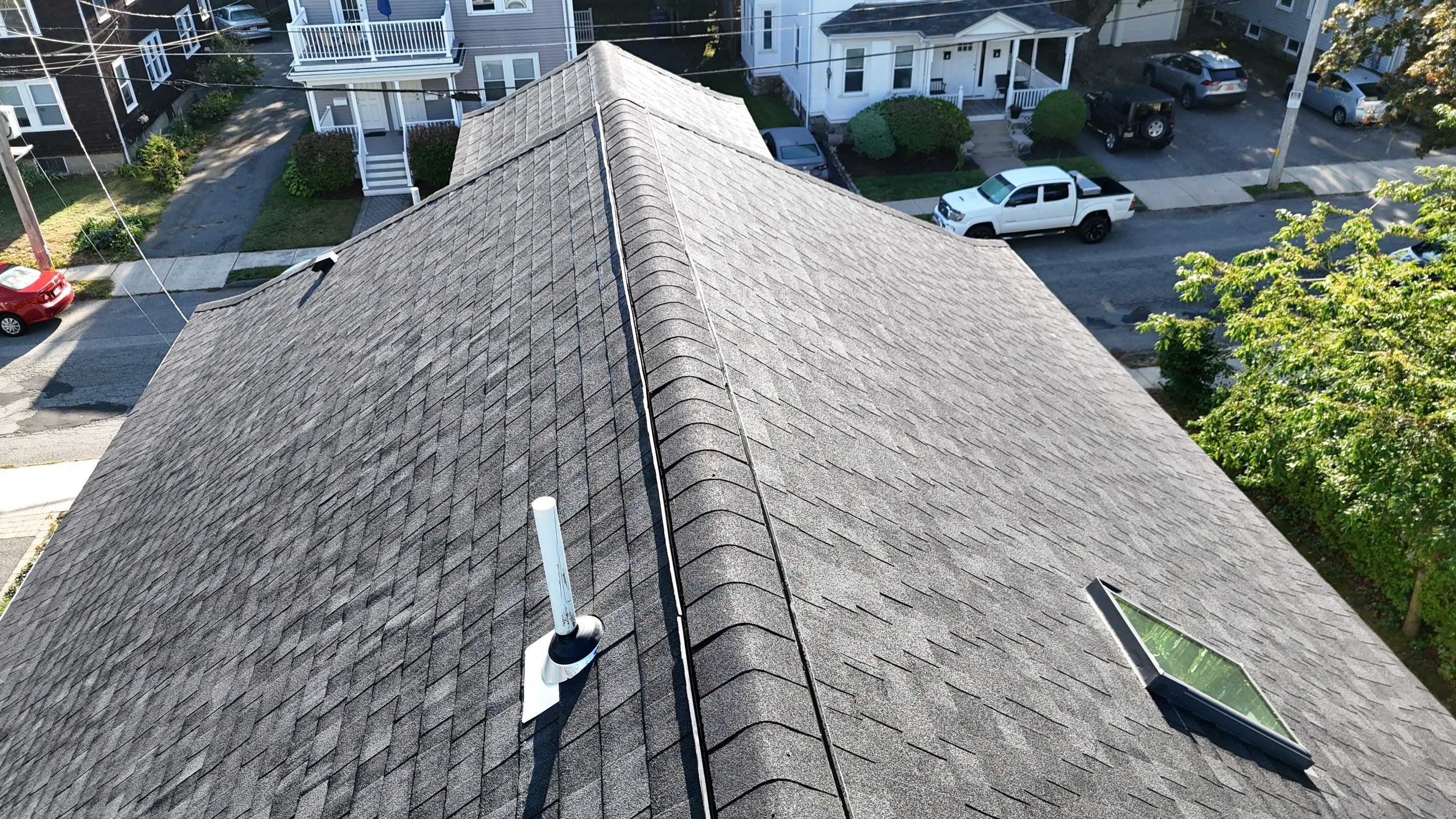 Roof Replacement with Skylight Flashing in Waltham, MA by Mighty Dog Roofing of Greater Middlesex County