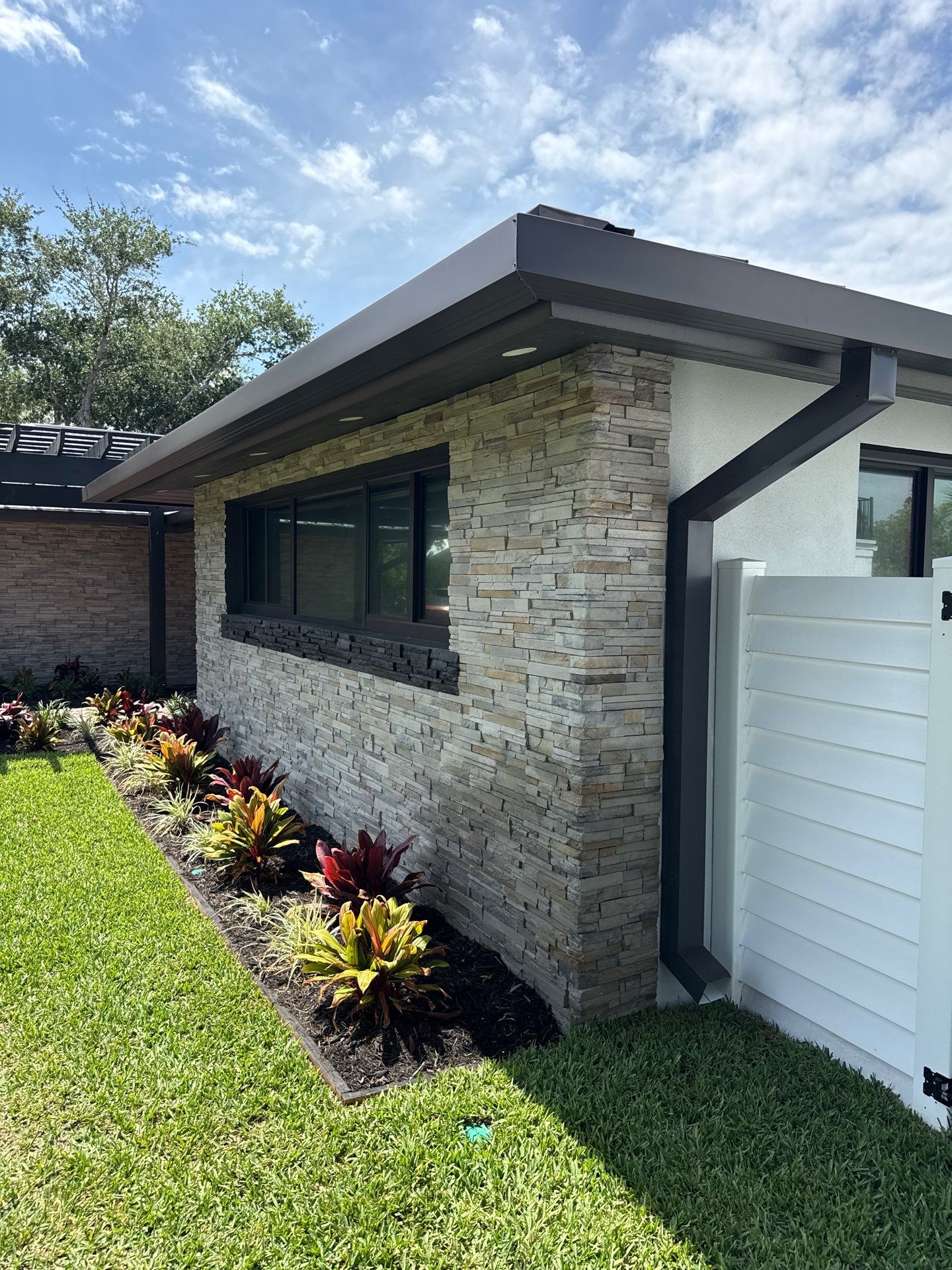 7-Inch Smooth Box Seamless Gutters using black seamless gutters in Siesta Key Fl by Gutter Professors
