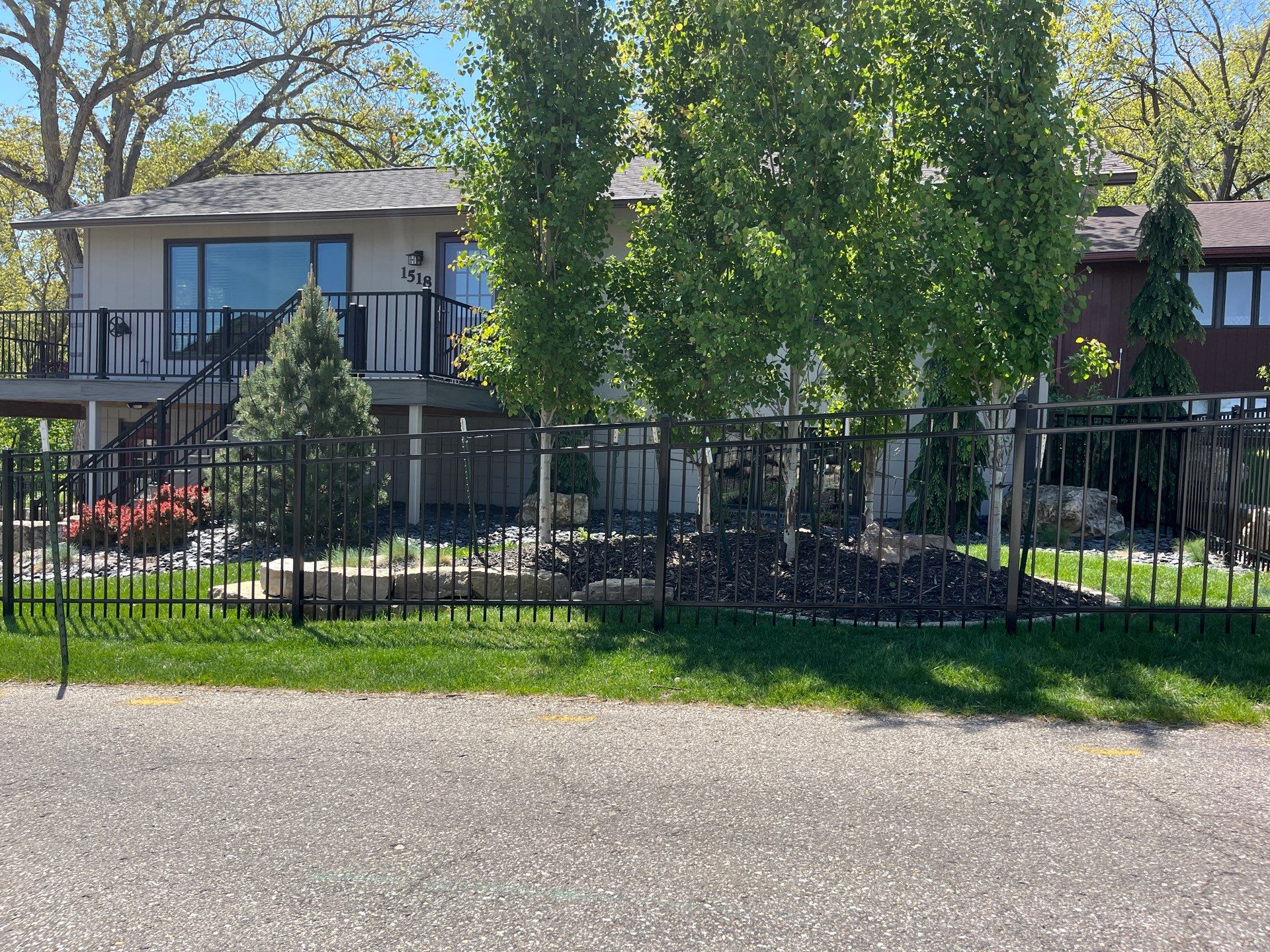 Ornamental Black Metal Picket Fence Installation in Cedar Falls by Perfect Picket Fence and Stain