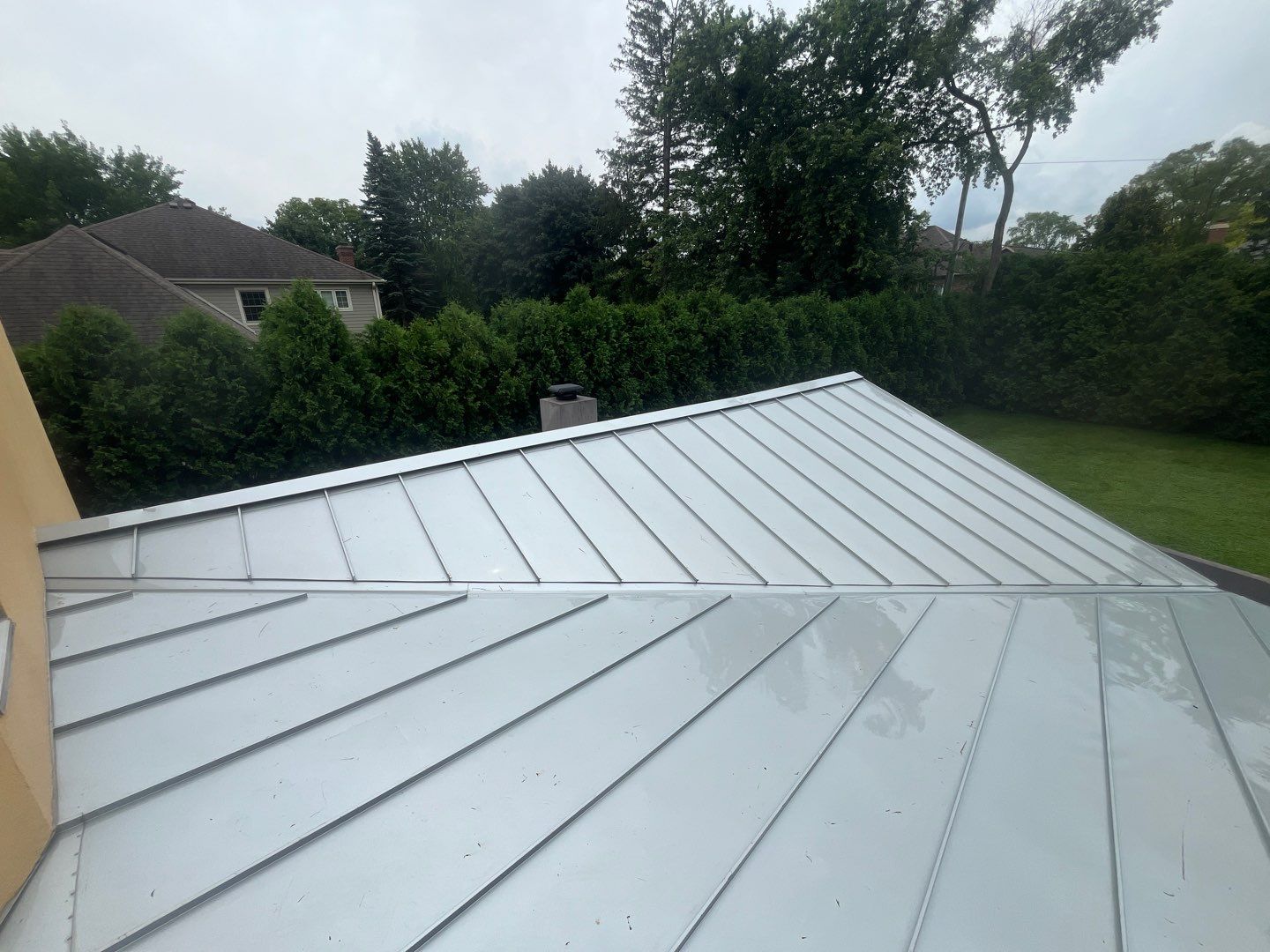 roof washing using Algaecide, soft wash soap by Northern Power Washing LLC.