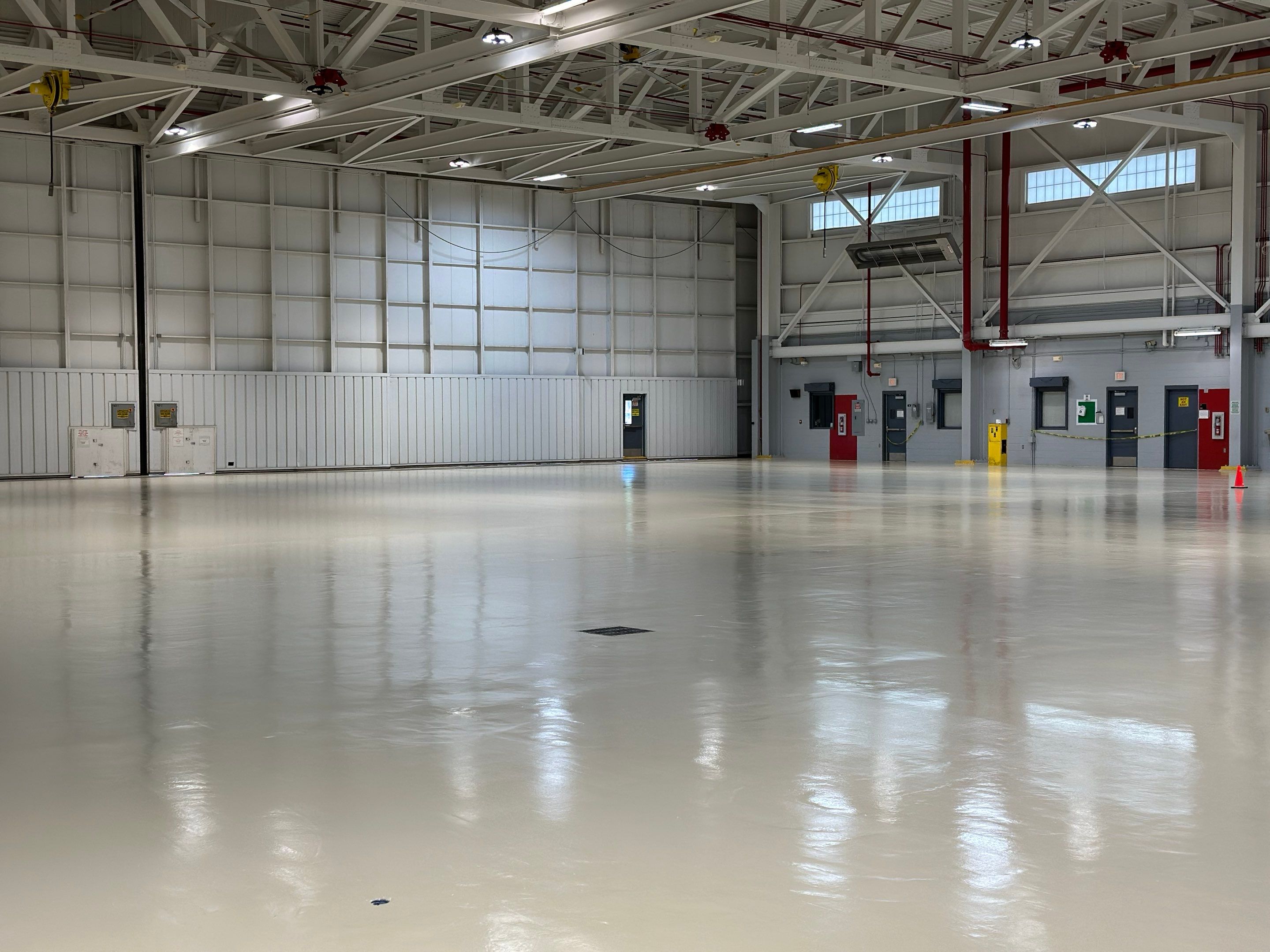 Industrial Epoxy Flooring for Army National Guard Hangar in Mobile by Cornerstone Hard Surface Restoration 